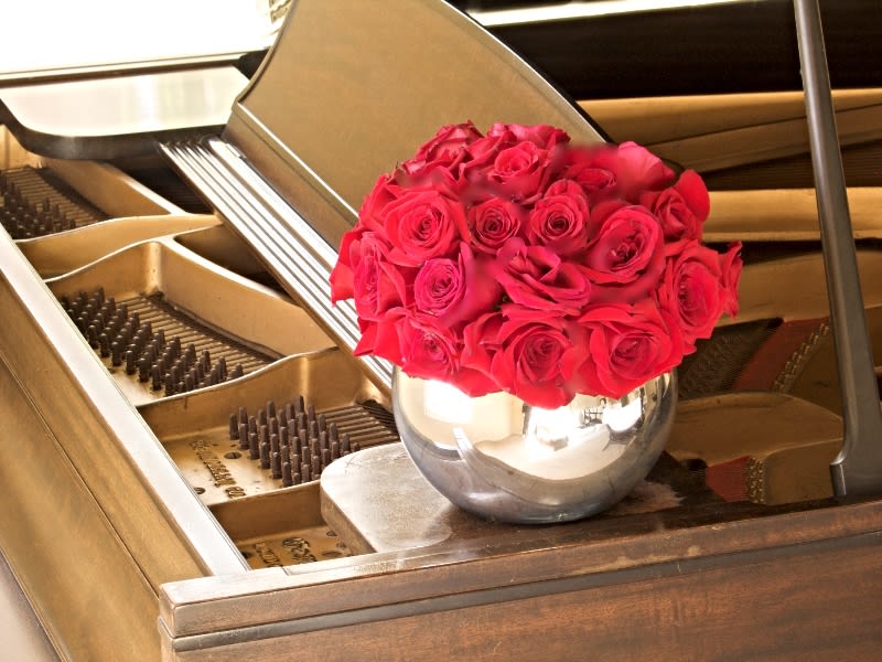 99 Two Dozen Red Roses - Stunning Two Dozen Red Roses in Fishbowl from T'sul Custom Floral Design in Newport Beach, CA  Make a timeless statement with our exquisite Two Dozen Red Roses, beautifully arranged in your choice of a silver, black, or white fishbowl, exclusively from T'sul Custom Floral Design in Newport Beach, CA. This elegant design blends classic beauty with a modern aesthetic, making it the perfect centerpiece for any occasion, whether it be a romantic gesture, anniversary celebration, or special event.  Upgrade for More:  Deluxe Arrangement: Enjoy a magnificent three dozen roses for an even more impactful display. Premium Arrangement: Opt for four dozen roses to create a breathtaking visual effect that will leave a lasting impression. Each arrangement features the freshest, high-quality red roses, ensuring vibrant color and longevity. The sleek fishbowl design complements the beauty of the roses and adds a contemporary touch to your decor.  Key Features:  Beautifully arranged two dozen red roses in a stylish fishbowl Available in silver, black, or white to match any decor style Perfect for weddings, anniversaries, birthdays, or just because Crafted with premium-quality roses for lasting beauty and fragrance Transform your Newport Beach space with T'sul Custom Floral Design’s stunning Two Dozen Red Roses in a modern fishbowl. Order today to bring a touch of elegance and romance to your home or special occasion! 