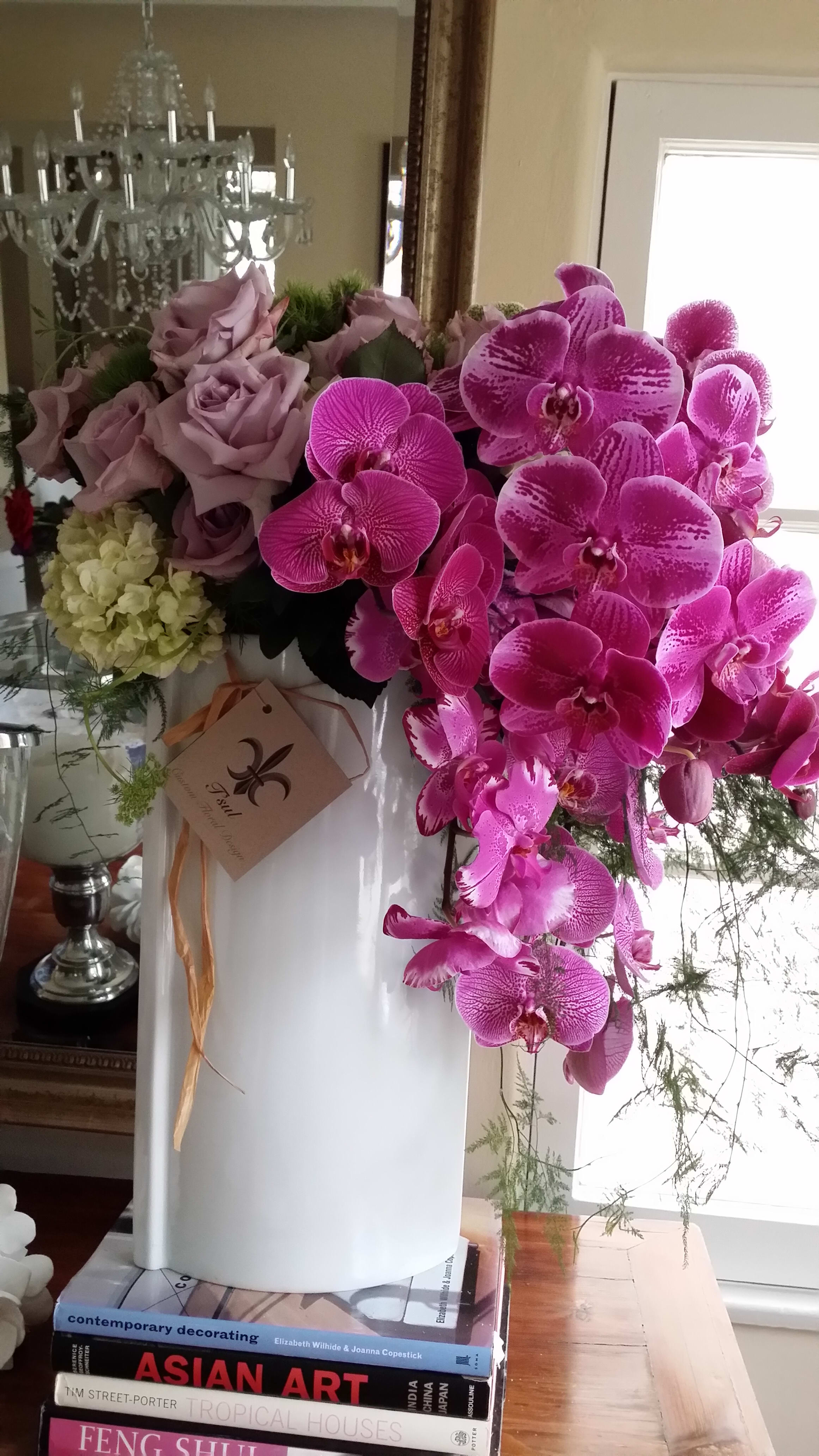 Everyday Luxury - Luxurious Tall Orchid Arrangement from T'sul Custom Floral Design in Newport Beach, CA  Indulge in the exquisite beauty of our Tall Orchid Luxury Arrangement, exclusively available at T'sul Custom Floral Design in Newport Beach, CA. This stunning floral display is the epitome of elegance, showcasing premium orchids arranged in a dramatic, towering style that commands attention and captivates the senses.  Perfect for upscale events, weddings, or as a luxurious accent in your home or office, this tall orchid arrangement adds a sophisticated touch to any setting. The striking height and vibrant colors of the orchids create a breathtaking focal point that enhances your decor.  Key Features:  Elegant tall arrangement featuring premium orchids for a luxurious display Perfect for high-end events, home decor, or as a thoughtful gift Crafted with the freshest, high-quality orchids for lasting beauty and fragrance Ideal for creating a stunning visual impact in any environment Transform your Newport Beach space with T'sul Custom Floral Design’s luxurious Tall Orchid Arrangement. Order today to experience the unparalleled beauty and sophistication of fresh orchids that elevate any occasion!