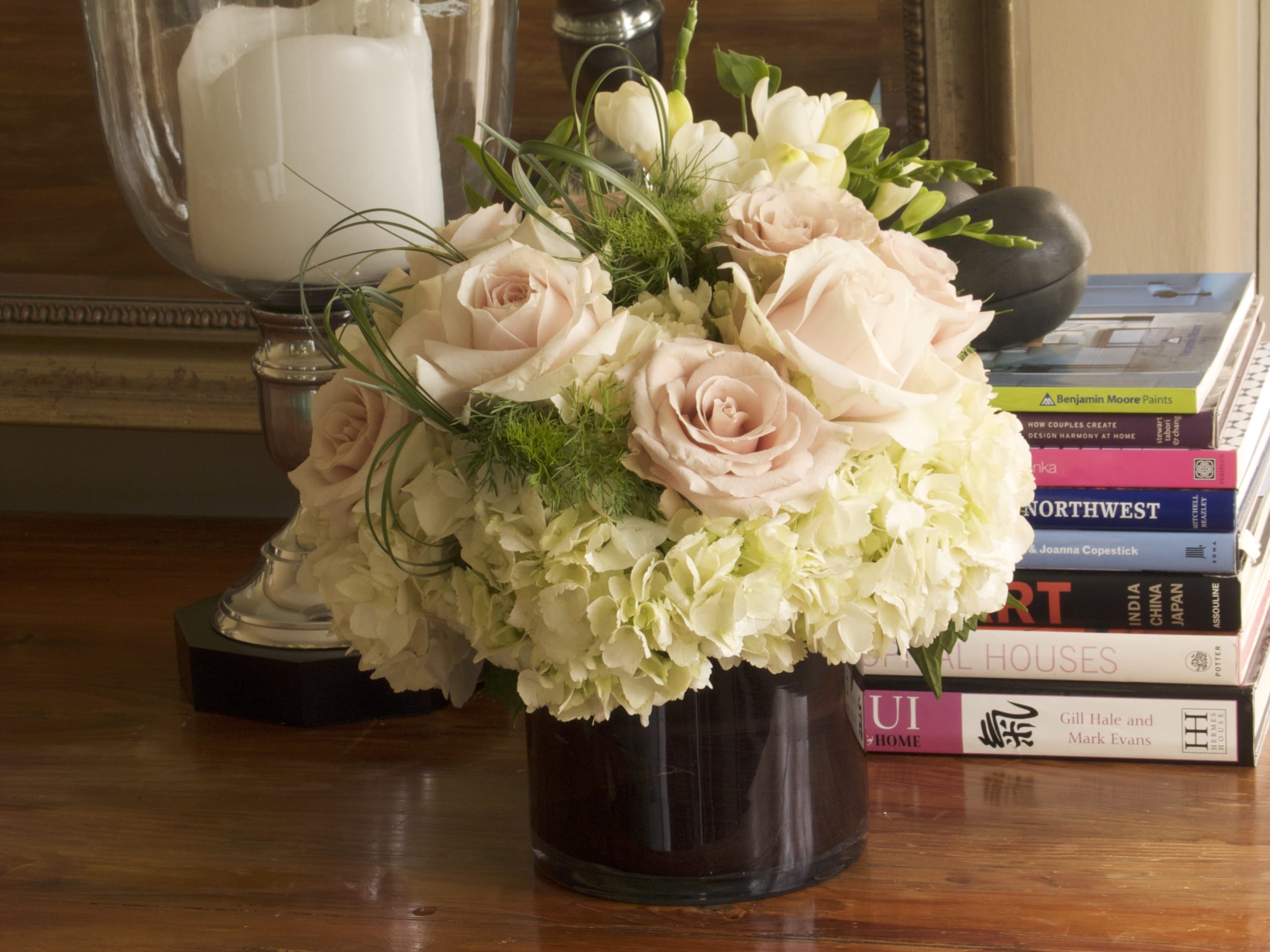 Special 199 Premium Rose Cylinder - Premium Rose and Hydrangea Arrangement in Glass Cylinder from T'sul Custom Floral Design in Newport Beach, CA  Elevate your decor with our stunning glass cylinder arrangement, beautifully lined with rich chocolate leaves and topped with exquisite Sweet Avalanche and Pink Sahara premium roses, accompanied by lush hydrangea. Exclusively crafted by T'sul Custom Floral Design in Newport Beach, CA, this elegant floral display is perfect for adding a touch of sophistication and charm to any space.  The unique combination of soft pink and creamy white roses, alongside vibrant hydrangea, creates a captivating visual appeal that is ideal for special occasions, weddings, or as an upscale gift. The glass cylinder design allows for 360-degree viewing, making it a striking centerpiece for dining tables, reception areas, or home decor.  Key Features:  Elegant arrangement featuring Sweet Avalanche and Pink Sahara premium roses with hydrangea Glass cylinder lined with luxurious chocolate leaves for a sophisticated touch Perfect for weddings, upscale events, or enhancing your home or office decor Crafted with fresh, high-quality blooms to ensure lasting beauty and fragrance Transform your Newport Beach environment with T'sul Custom Floral Design’s exquisite rose and hydrangea arrangement in a glass cylinder. Order today to bring the timeless beauty of fresh flowers into your life! 