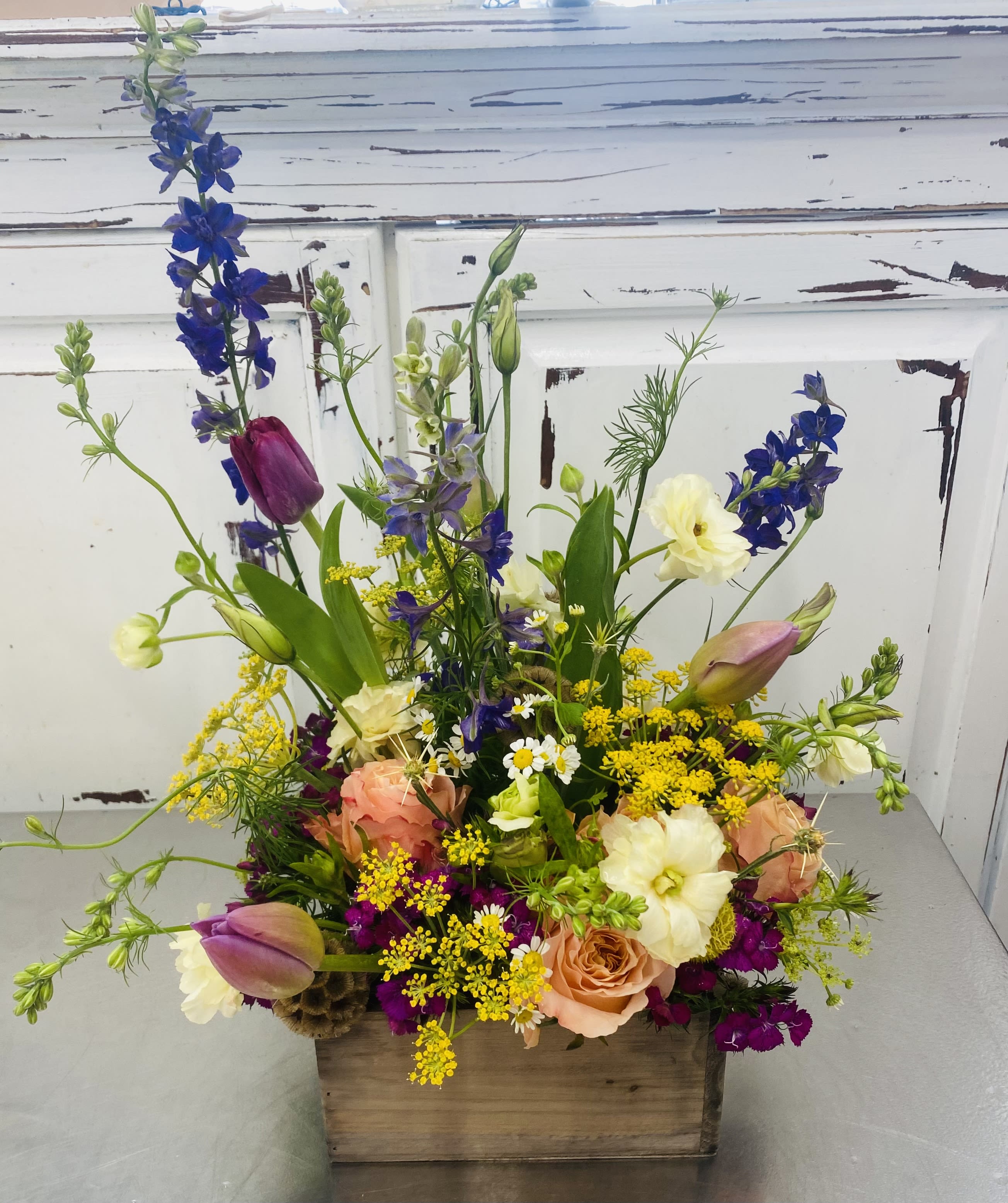 Boxed Garden  - This garden style Is designed in a re-useable Wooden Box, A Very Country vibe.  Assorted, in season flowers in a rainbow of colors. Please specify occasion and we will design this with the season, occasion and gender of recipient.  Any questions or concerns, kindly call us directly 707-479-1606 