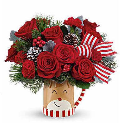REINDEER DREAMS REINDEER DREAMS - Overflowing with festive blooms, this adorable reindeer delivers your holiday wishes! The glazed ceramic mug adds a whimsical touch to your seasonal sipping. From November 14 through December 31, 15% of the purchase price from all Teleflora's Send A Hug® Reindeer Wish Bouquet and Send A Hug® Merry Reindeer Tree sales will directly help grant children's wishes with Make-A-Wish.* *Total campaign donation to Make-A-Wish to equal $250,000. This delightful bouquet showcases red roses, red carnations, miniature red carnations, dusty miller, douglas fir, and white pine. It's beautifully presented in Teleflora's Send a Hug® Reindeer Wish Mug, perfect for spreading holiday cheer. Orientation: All-Around