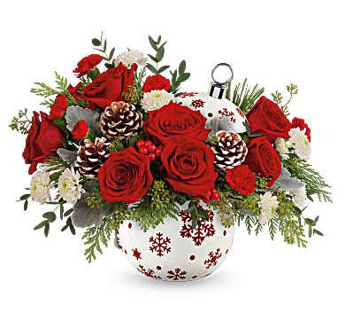 SPARKLING SNOWFLAKE HOLIDAY FLOWER ORNAMENT SPARKLING SNOWFLAKE HOLIDAY FLOWER ORNAMENT - Capture the essence of a classic Christmas with stunning red roses and fresh white pine elegantly arranged in a shimmering, hand-painted ceramic ornament jar-a gift they'll cherish forever. From November 14 through December 31, 15% of the purchase price from all Teleflora's Sprinkle Sparkle Bouquet and Sparkle All The Way Bouquet sales will directly help grant children's wishes with Make-A-Wish.* *Total campaign donation to Make-A-Wish to equal $250,000. Celebrate the holidays with this festive bouquet featuring red roses, red carnations, miniature red carnations, cedar, dusty miller, and noble fir. Teleflora's Sparkle All The Way Bouquet is elegantly delivered in Teleflora's Sprinkle Sparkle Ornament, adding a touch of seasonal charm to your celebrations. Orientation: All-Around