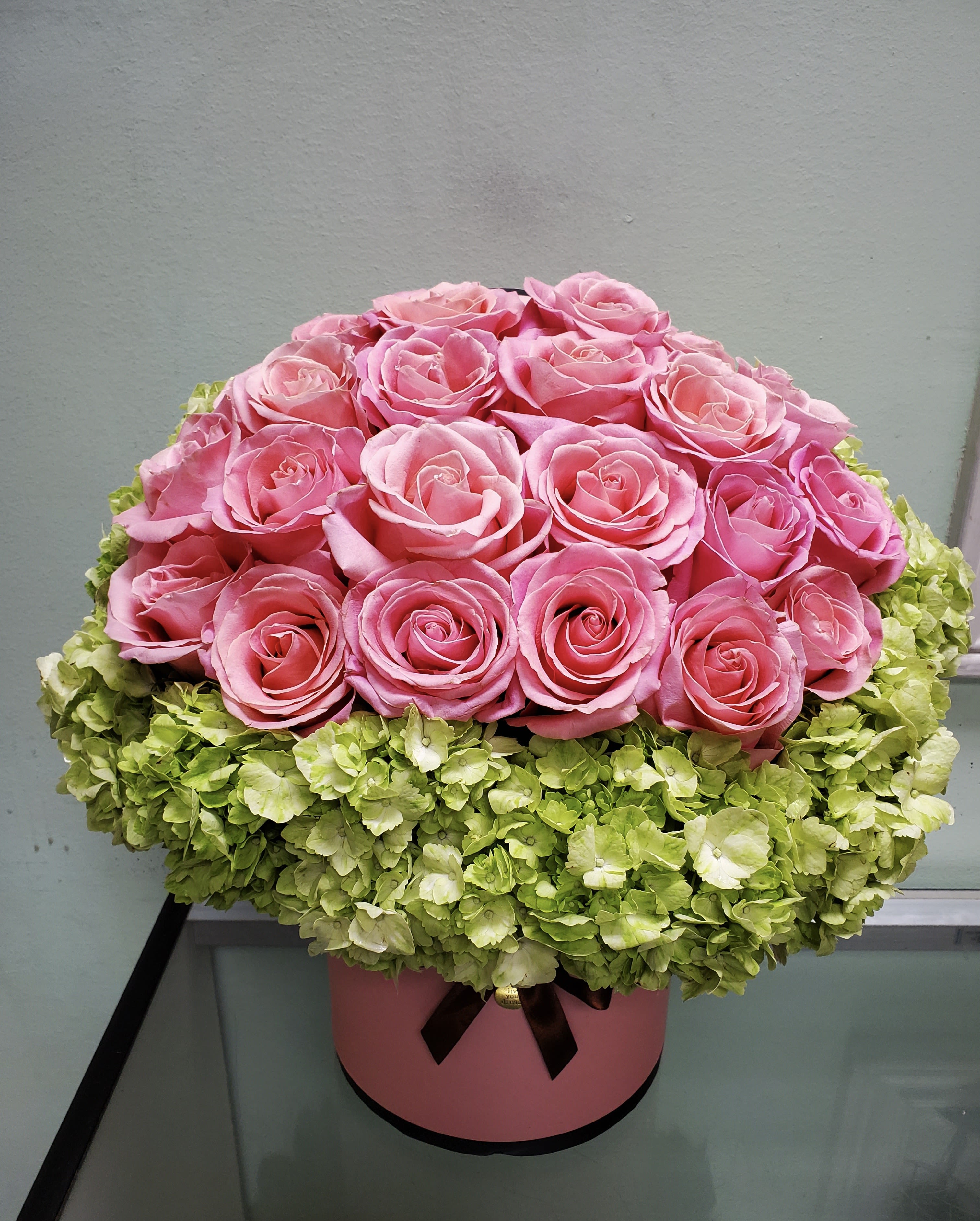 Pink Rose Hill Pink Rose Hill - Box arrangement with pink roses and hydrangeas.