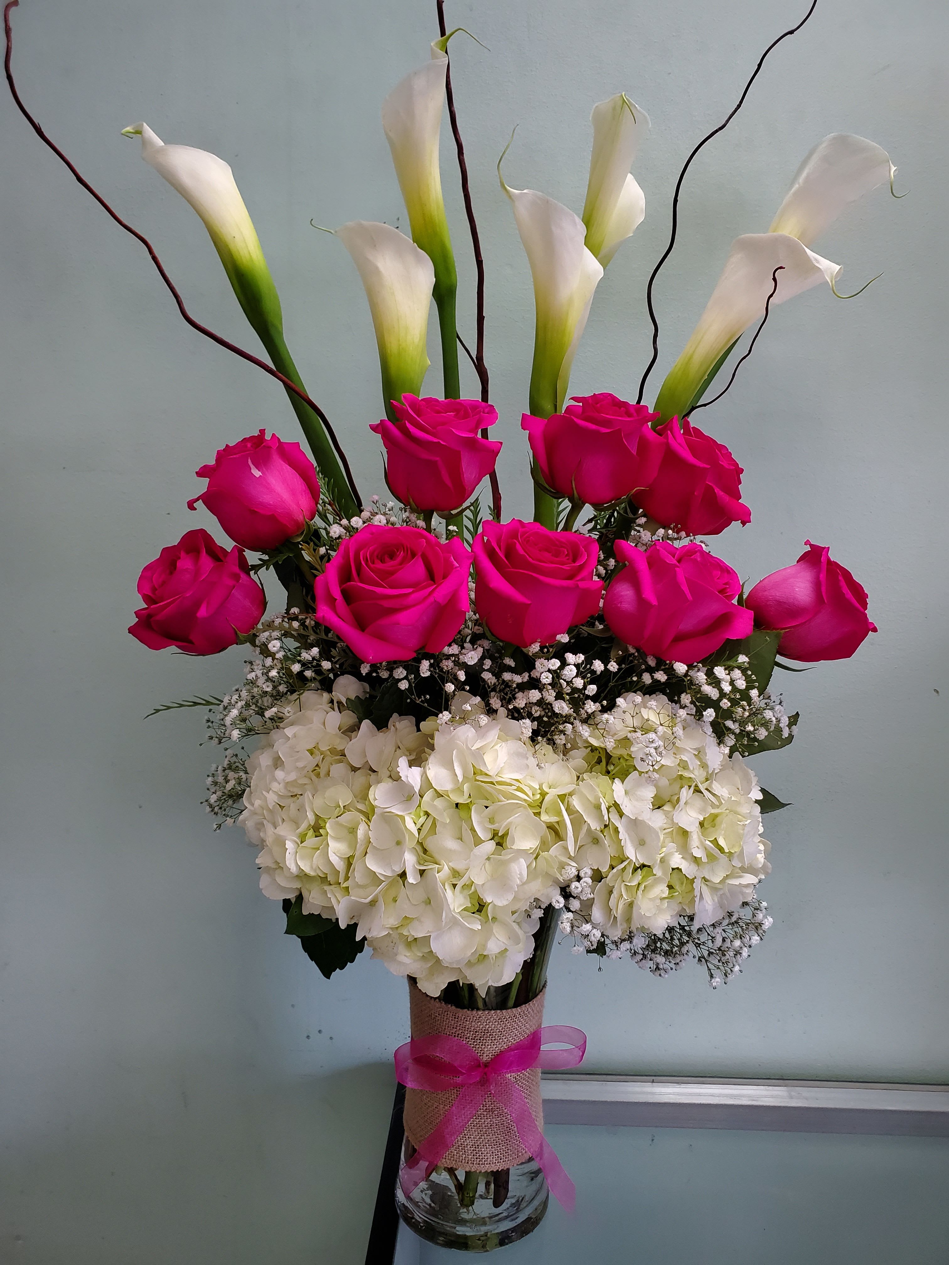 Blossoming Beauty Blossoming Beauty - Vase arrangement with roses, calla lilies, and hydrangeas.