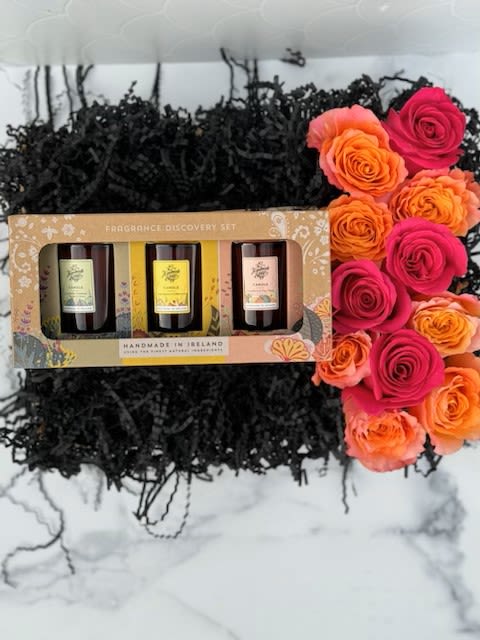 Flowers &amp; Fragrance Gift Box - A beautiful display in a wooden crate filled with hot pink and hot orange florals, and our &quot;Fragrance Discovery Set&quot; gift package from 'The Handmade Soap' company. This gift package features 3 candles including different scents such as lavender, rosemary, lemongrass, and grapefruit. All products from the 'The Handmade Soap' company handmade in Ireland, all natural, Vegan friendly and Cruelty Free. It is the perfect gift for any occasion!