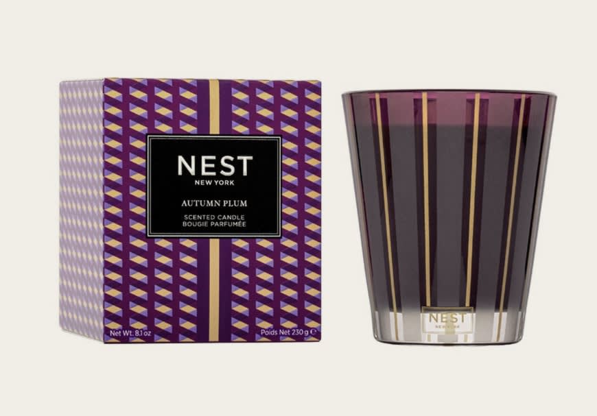 Autumn Plum Classic Candle Autumn Plum Classic Candle - This fall Classic Candle captures the sweet, woody aroma of freshly fallen autumn leaves with wild plum and cinnamon wrapped in the warmth of patchouli leaf and cashmere wood. Purple-tinted wax housed in a glass vessel of the same color with elegant gold and frosted stripes. This exquisitely fragranced candle is meticulously crafted with a proprietary premium wax formulated so the candle burns cleanly and evenly and infuses a room with exceptional scent.