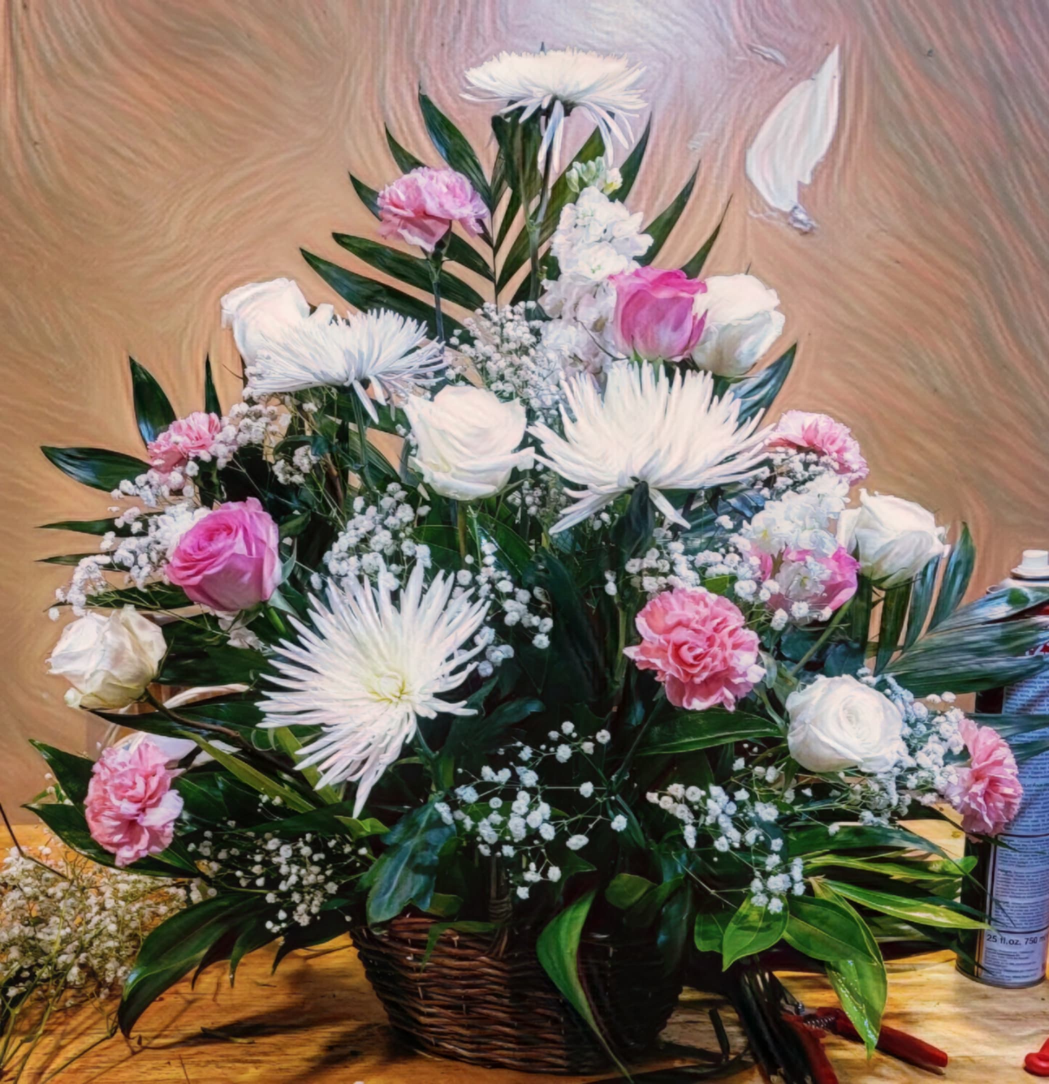 Pink and White Blossom Basket Pink and White Blossom Basket - Our Pink and White Blossom Basket is a beautiful arrangement of fresh white and pink roses, delicate white spiders, and charming pink carnations. The arrangement is accented with baby’s breath and commodore, all nestled in a lovely wicker basket. This basket is perfect for any occasion and is sure to bring a smile to anyone’s face.” What do you think