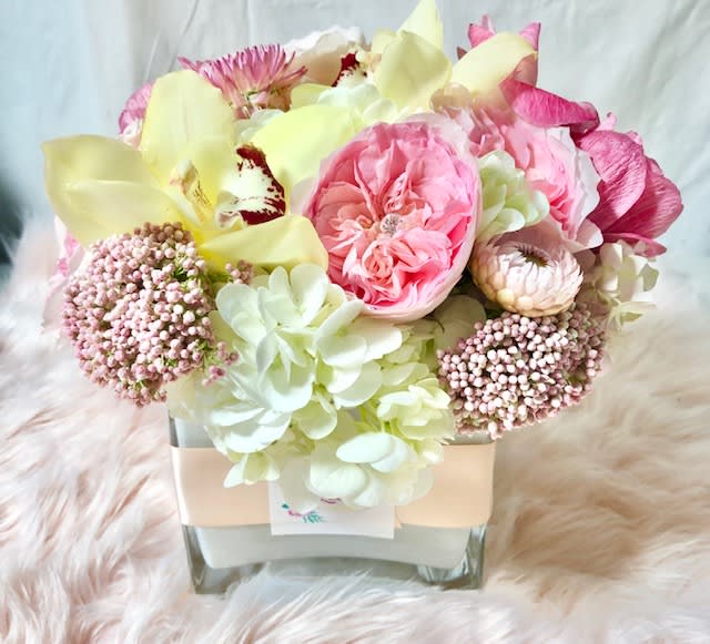Something Fabulist  - medium size floral in white glass vase fill with fabulist seasonal flowers 