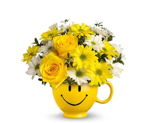 Happy Mug Bouquet - A combination of daises and roses in a smiley face mug