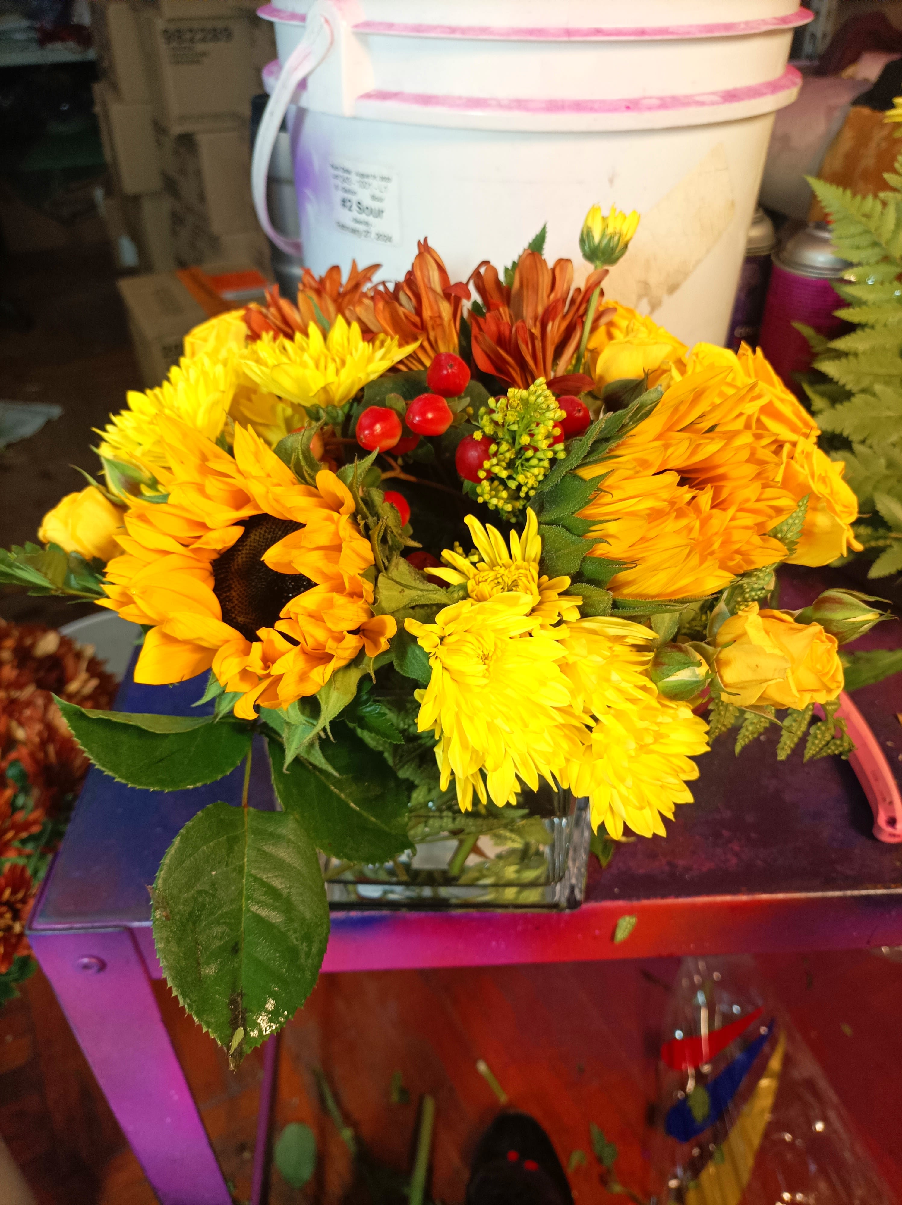Sunny Sunflowers - The sun is pretty great, but sunflowers are the greatest. Let’s prove it. The sun keeps us warm, we’ll admit it, but sunflowers never make us sweat. The sun gives us the daytime, which we appreciate, but sunflowers don’t go away for 12 hours per day day. Sunflowers, unlike the sun, know that would be rude. Finally, the sun gives us a nice tan once in awhile, but sunflowers have never given anyone a sunburn. This autumn, let sunflowers enhance your life, or the life of a loved one, with this Sunny Sunflower arrangement! You will not regret it.