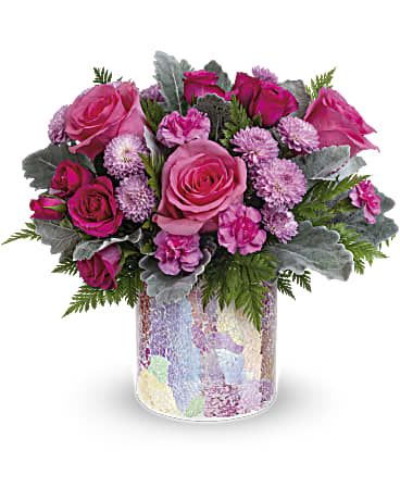 Radiantly Rosy Bouquet Radiantly Rosy Bouquet - 3 each roses, 50cm, pink 2 stems roses, spray, hot pink 1 stem carnations, miniature, pink 2 stems chrysanthemums, button spray, lavender 1 stem dusty miller 2 stems leatherleaf fern 1/3 block floral foam 1 Radiantly Rosy Cylinder, pink, teleflora, 23S100, (4 3/4" h x 4 1/2" w