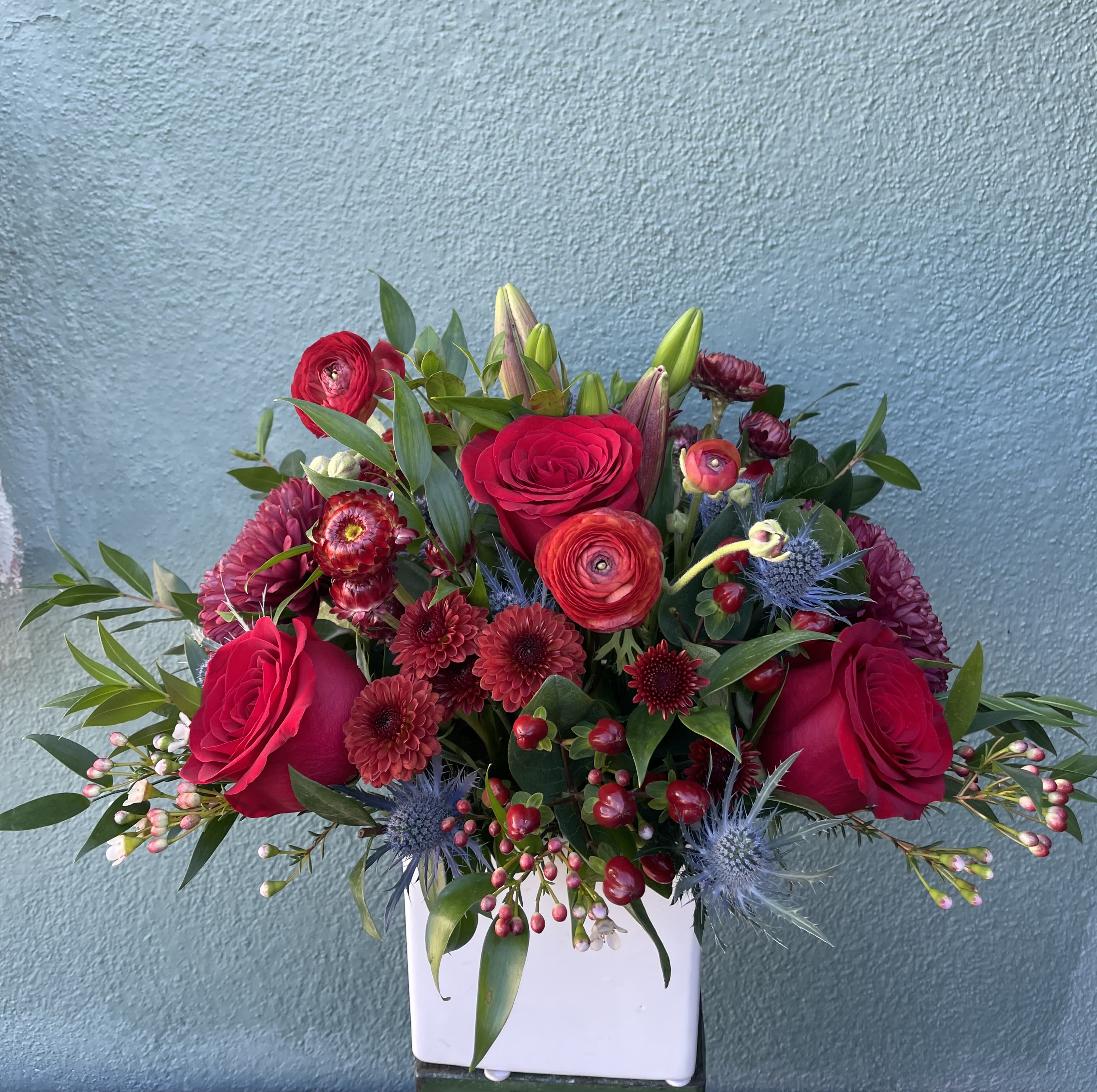 Red Berry Red Berry - This arrangement includes beautiful red mix flowers all hand arranged in vase.