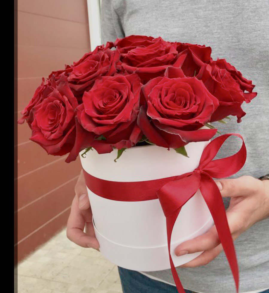 Red Splendor Red Splendor - The bouquet consists of bright red roses neatly arranged in a white round box with a red ribbon tied in a bow.