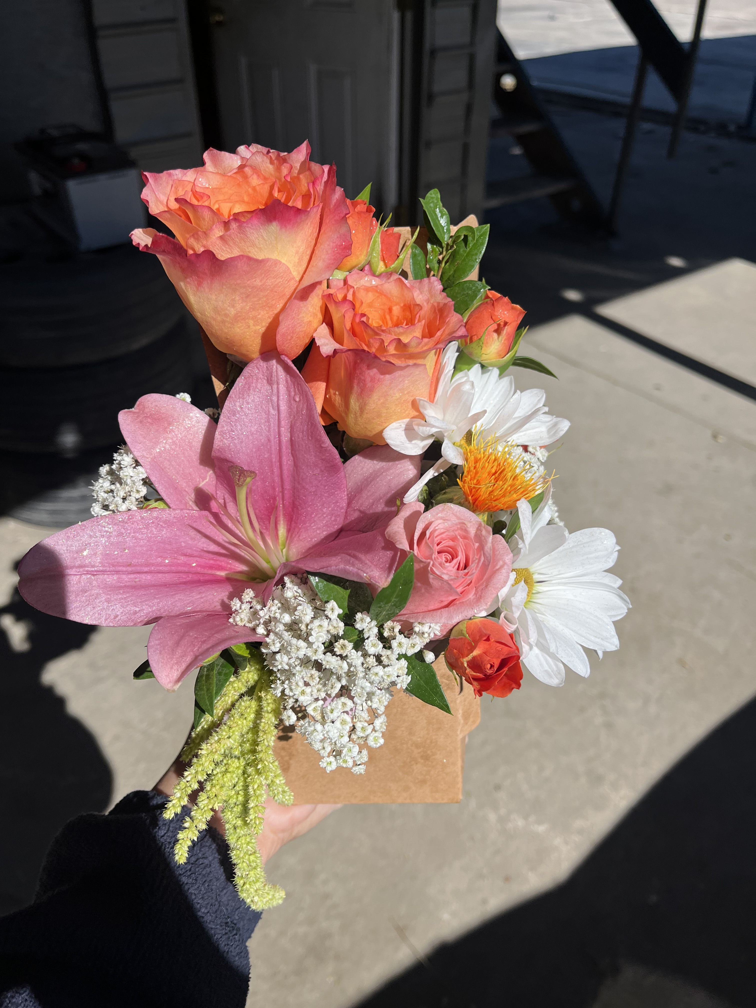To-Go cup holder with flowers - Flowers arranged in to-go cup holder,  drink on the other side is coffee by default but is customizable.