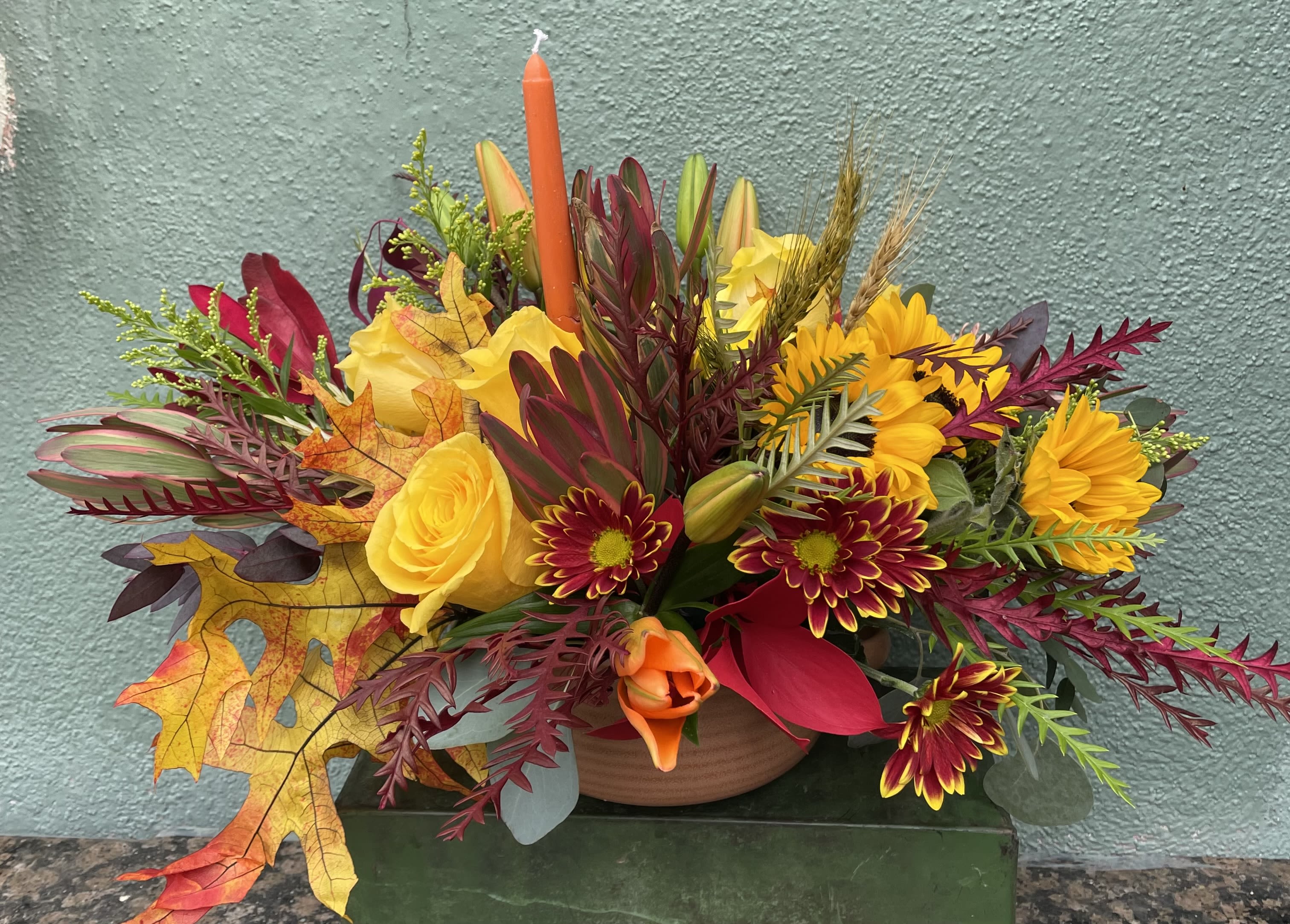 Gratitude Gratitude - This arrangement is perfect for your Thanksgiving dinner, it includes a variety of fall flowers all hand arranged in ceramic pot.