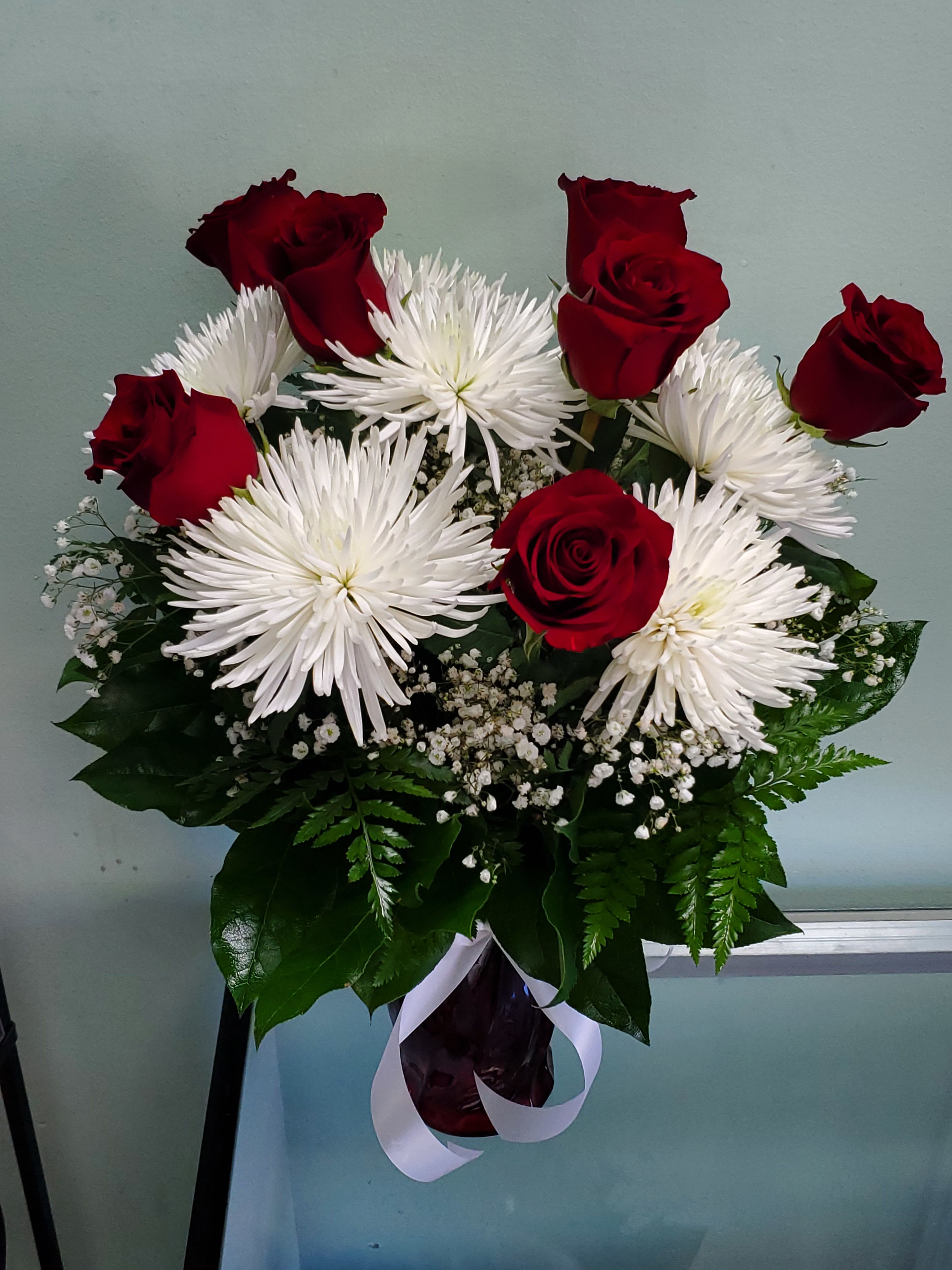 Star Love Star Love - Vase arrangement with roses and mums.