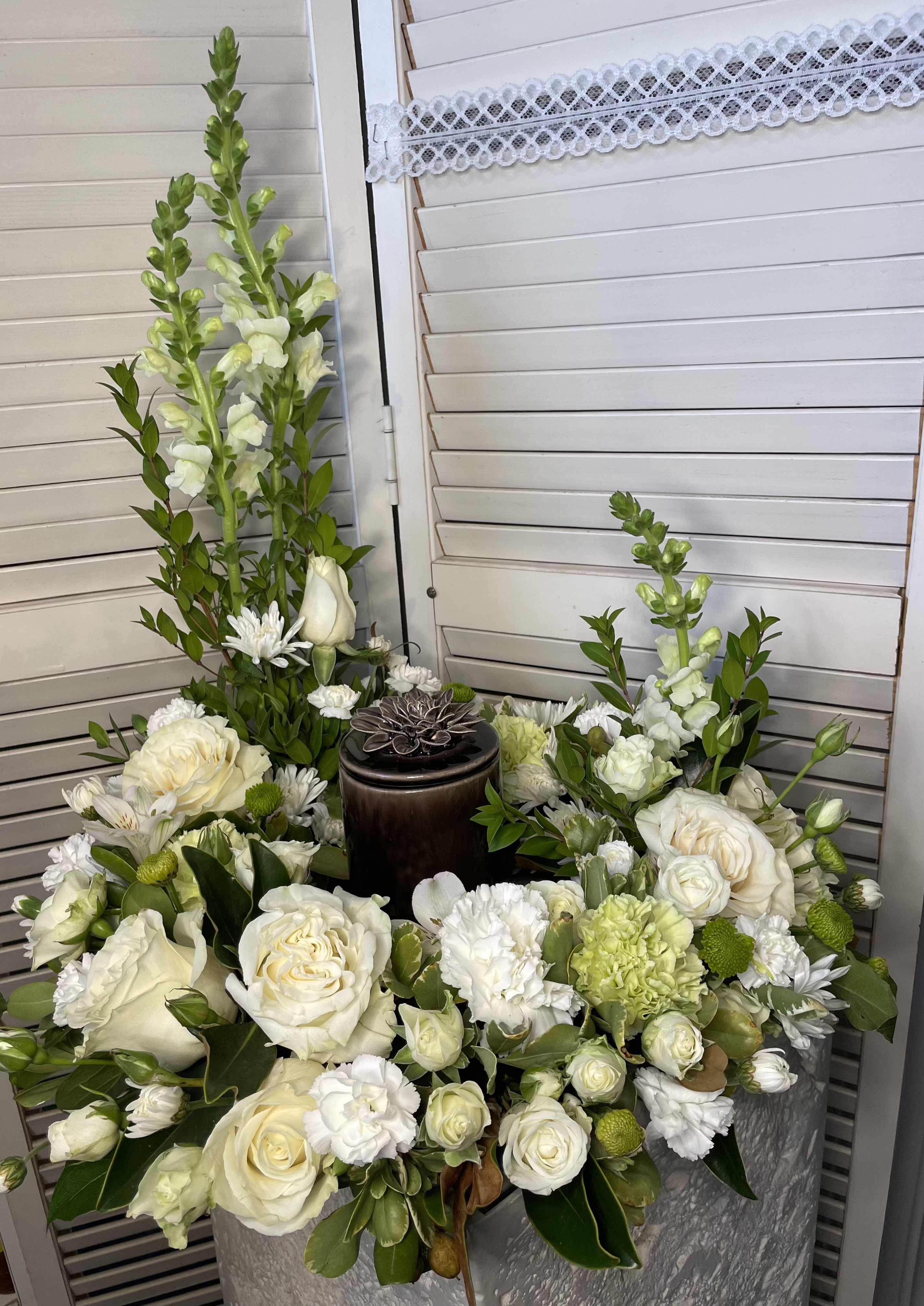 Remembrance  - A white and green tribute, this white and green funeral urn is pure and tranquil. Featuring a variety of white and green flowers.