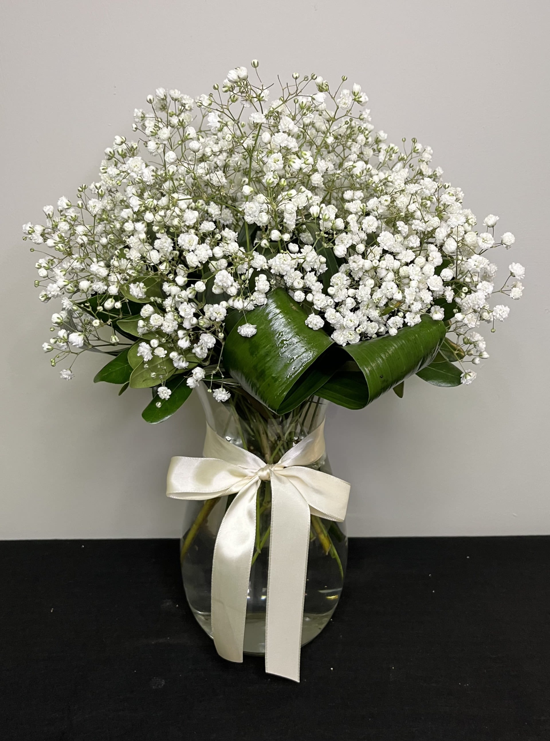 Angel's Whisper by Chasing Petals - Vase arrangement of soft and dainty babies breath, tied with a soft satin bow.