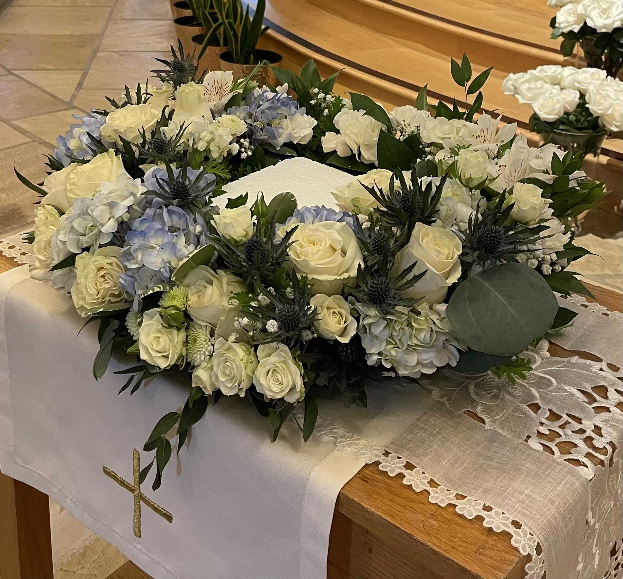 Ocean Breeze Urn - A white and blue tribute, this urn arrangement compliments the beauty of life.