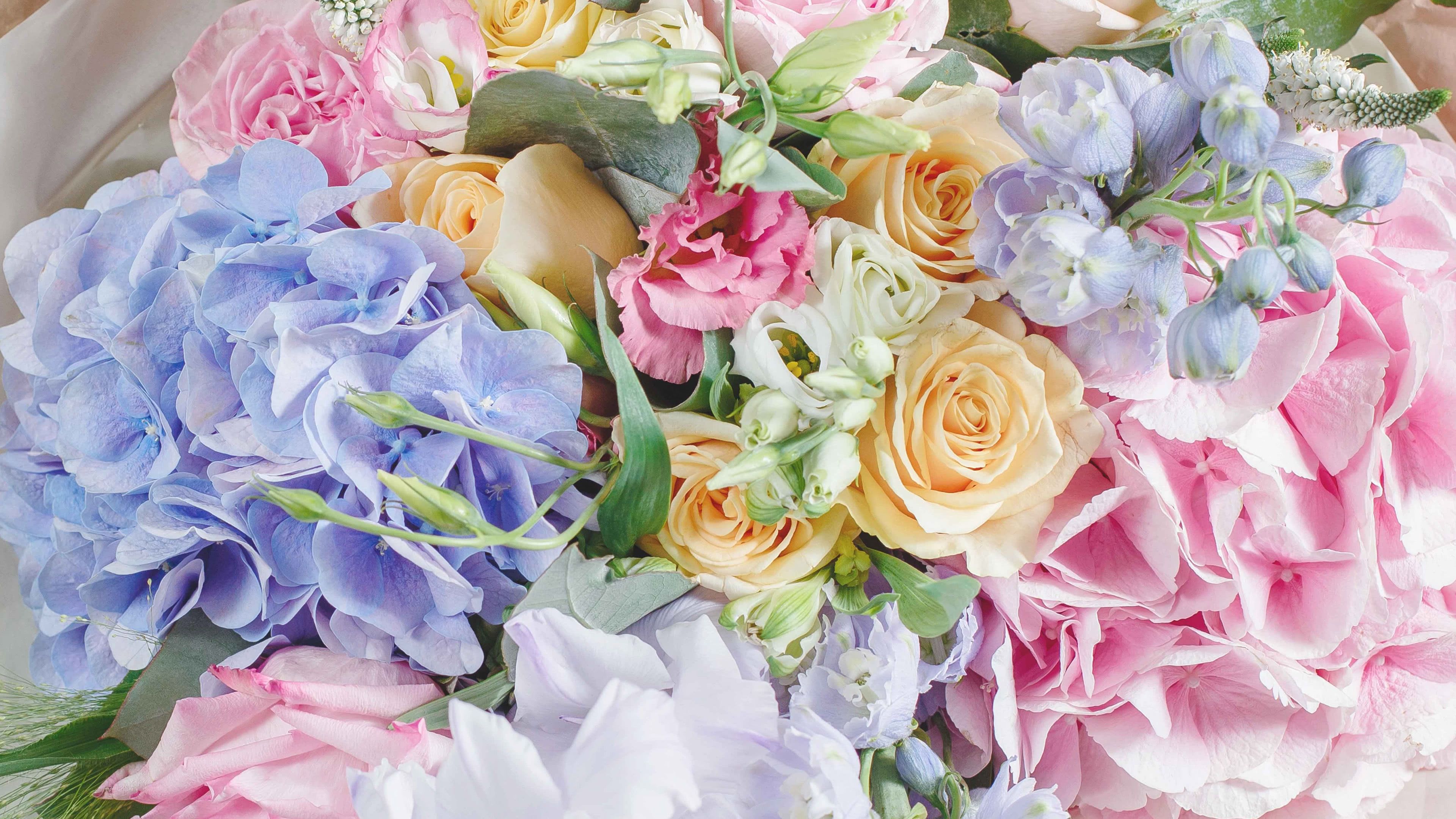 Soft Pastel Vase Arrangement Designer's Choice by Chasing Petals - A carefully selected vase arrangement of assorted pastel coloured flowers, chosen uniquely for your order by our designer.   Please note the selection, colours and style of the arrangement will vary order to order. Please call us with any specifications or requirements you may have. 
