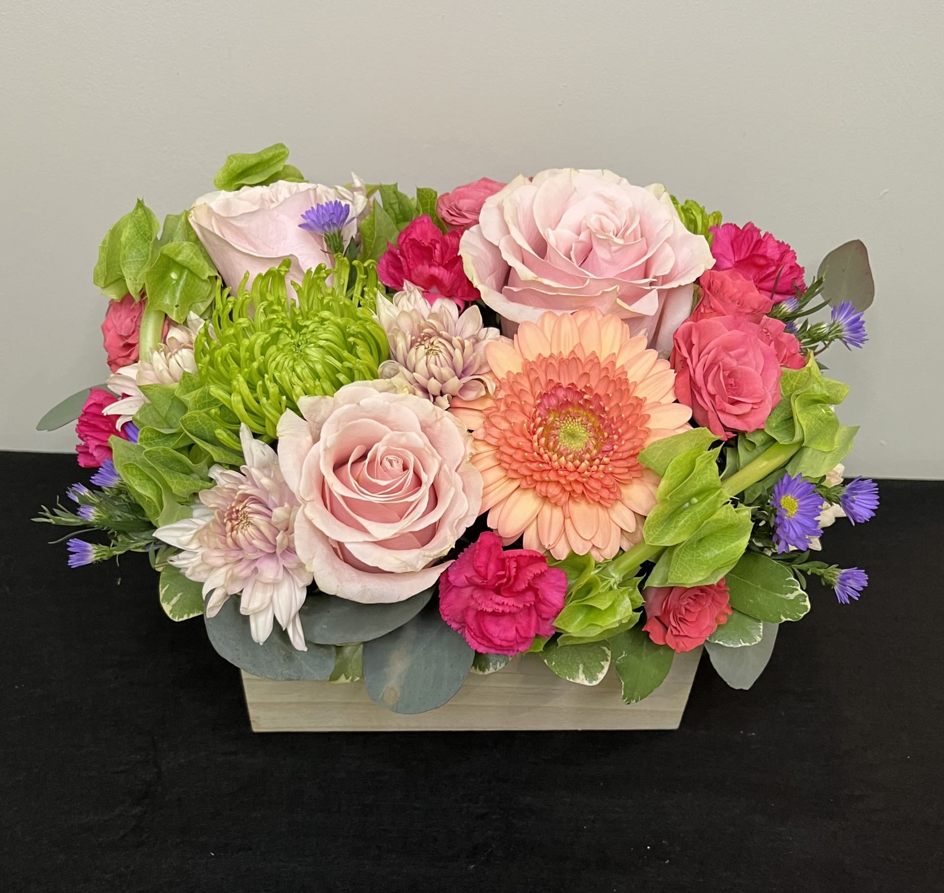 Spring Meadow by Chasing Petals - Vibrant and happy spring colours sure to bring a smile to anyone's face! Mixed flowers arranged in a wood box exude happiness and spring sunshine!