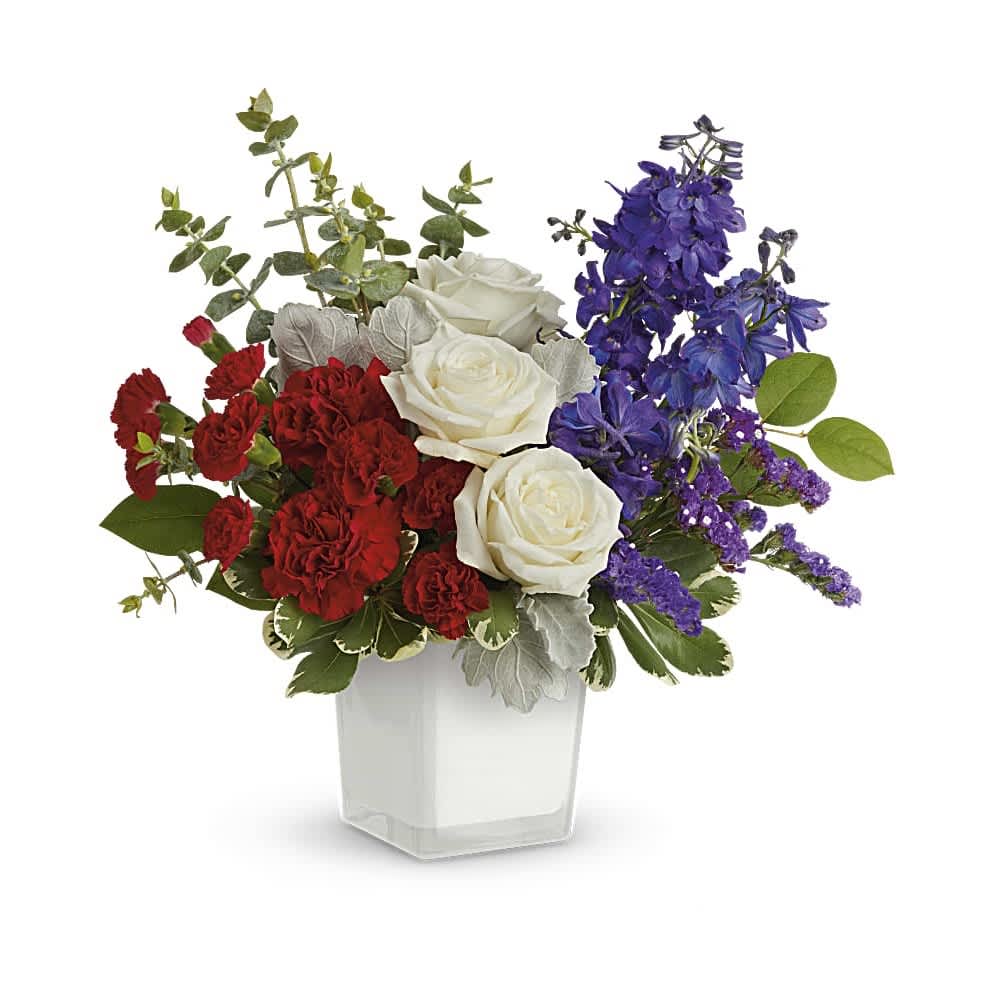 Celebrating You Bouquet - Red, white and YOU! Make them feel truly appreciated with this playful bouquet in a chic white cube vase. White roses, red carnations, miniature red carnations, blue delphinium and blue sinuata statice are arranged with dusty miller, spiral eucalyptus, variegated pittosporum and lemon leaf. Delivered in The Color Splash Cube.