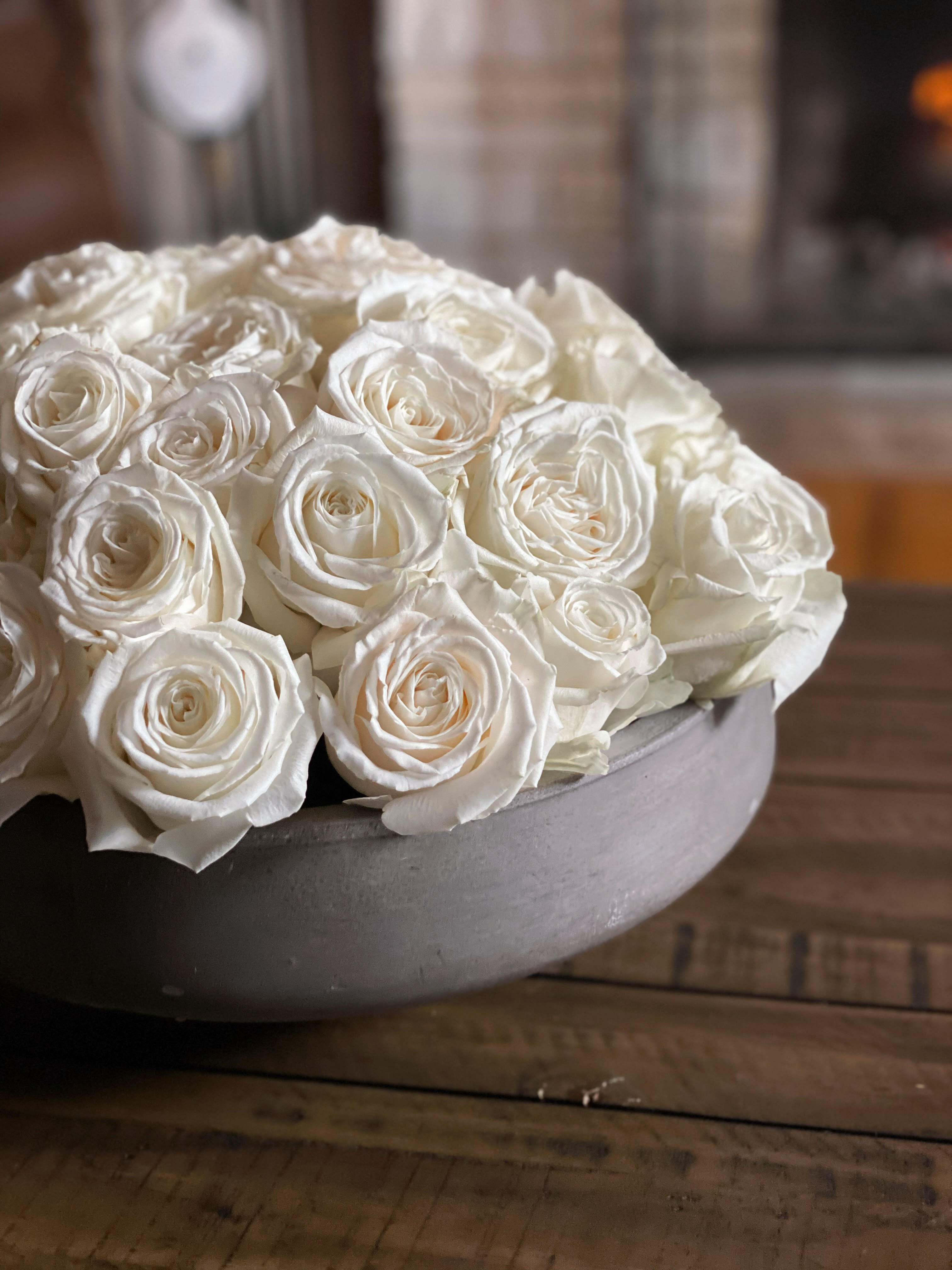 &quot;The Kardashian&quot; - In a high end ceramic bowl, 4 dozen white playa blanca roses arranged in a modern design. 