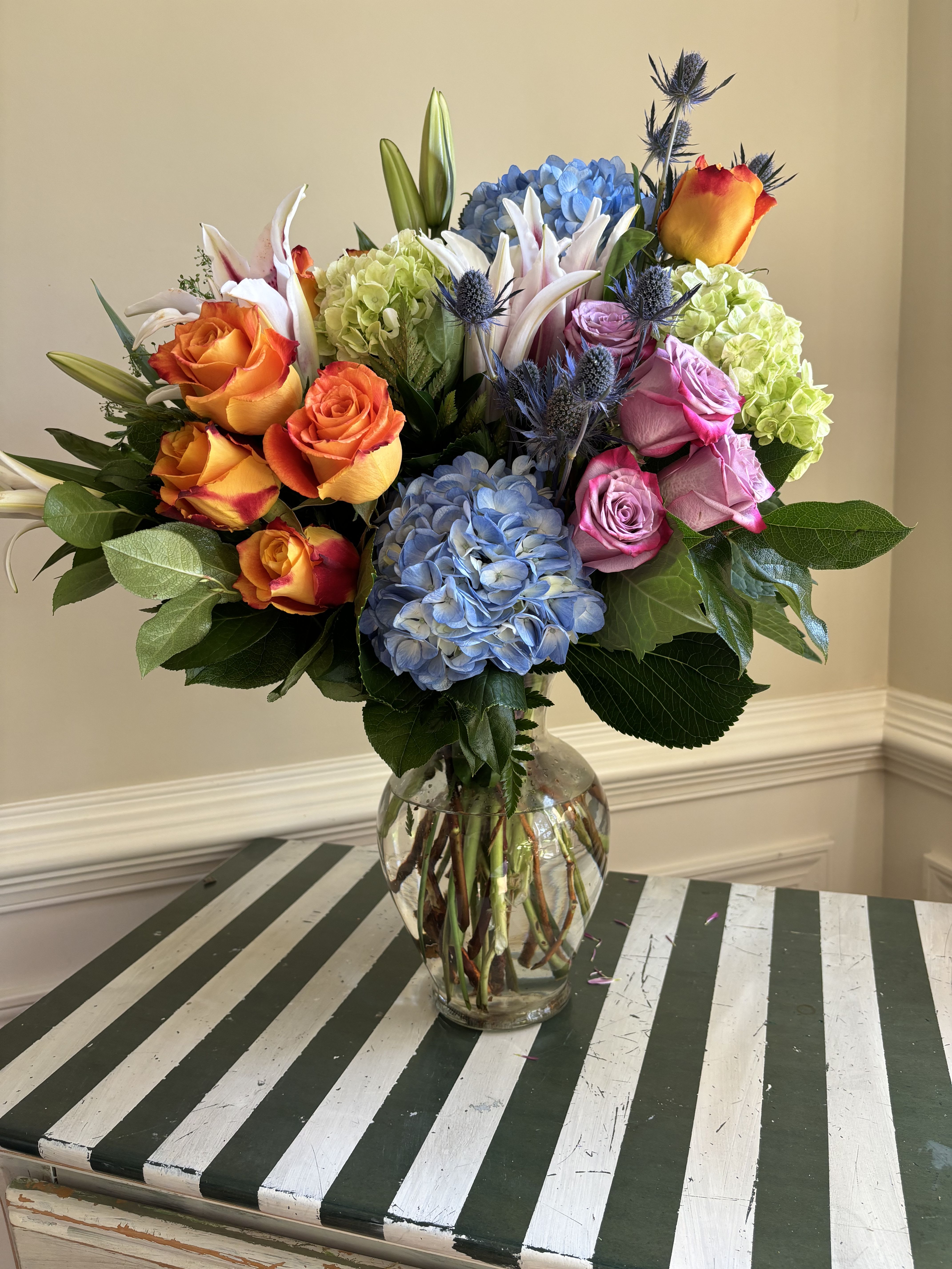 Market Street Florals - Hand a garden of colorful hues to your loved one who may need a reason to smile! We love creating this beauty for our beloved customers as an expression of sympathy or a gesture of love &amp; care.