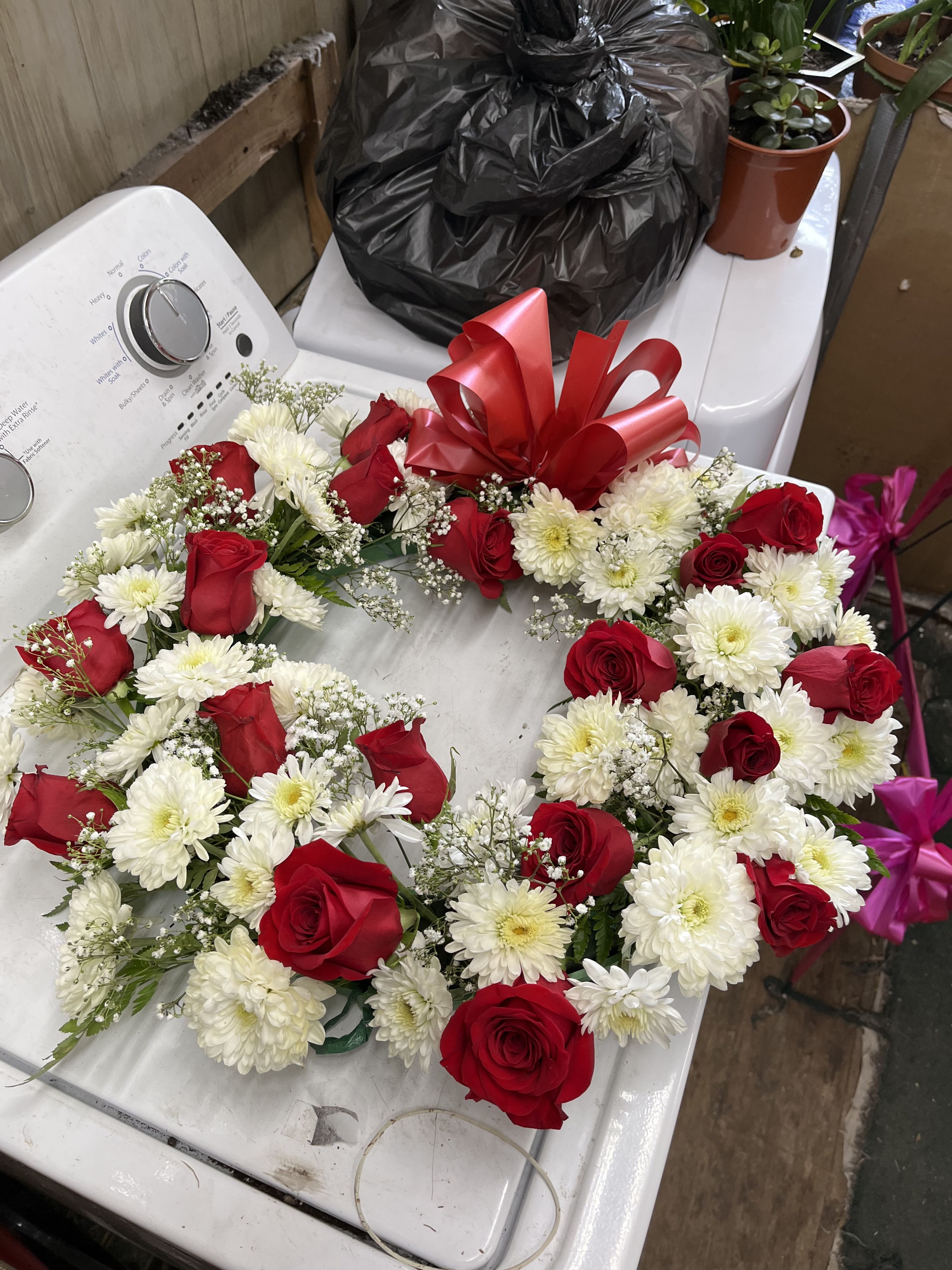 Lasting Serenity by BloomNation™  - A beautiful white and green tribute wreath that calms, this easel arrangement celebrates a full life and a peaceful passing. 