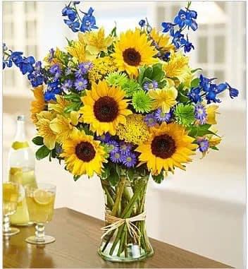 Fall vase Fall vase - Clear vase with beutiful blue delphinium and soonflowers astros yellow and dayses
