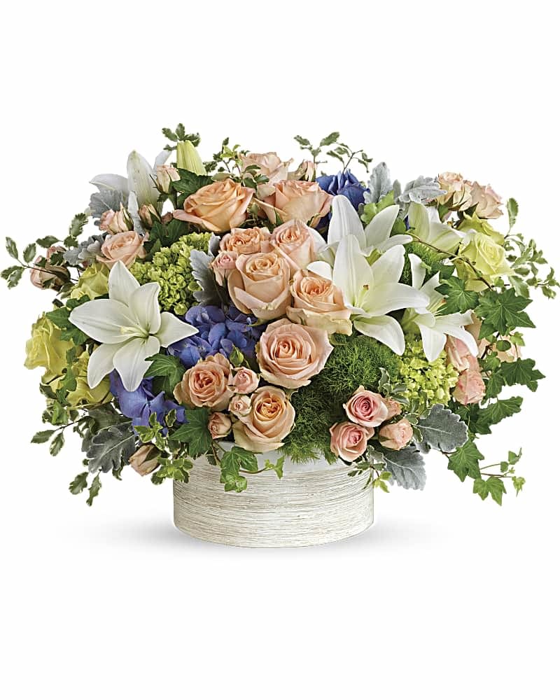 [TT-ARR64 D]:  INTOXICATING BEAUTY DELUXE - Twin Towers Florist, Arlington VA - Luxuriate in the natural, intoxicating beauty of this chic arrangement. Inspired by a wild garden, this composition of whisper-peach roses, white lilies and moody purple hydrangea is beautifully presented in a modern ceramic planter. This gorgeous arrangement includes purple hydrangea, miniature green hydrangea, green roses, peach roses, peach spray roses, white asiatic lilies, green trick dianthus, dusty miller, pitta negra, and green ivy.