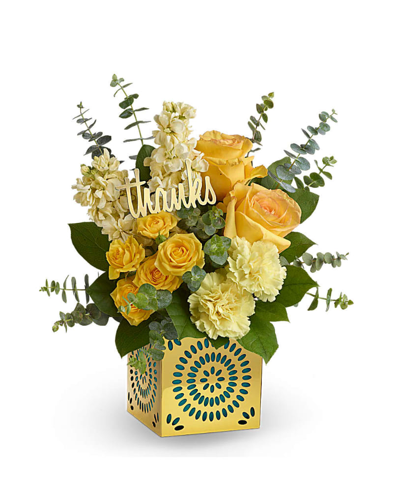 Shimmer Of Thanks Bouquet - Show your appreciation in a most stylish way with this sunny bouquet of yellow roses, stock and carnations! The happy bouquet is hand-delivered in a shimmering golden cube with delicate cutouts. Remove the teal liner and &quot;thanks&quot; and the cube becomes a contemporary candleholder.