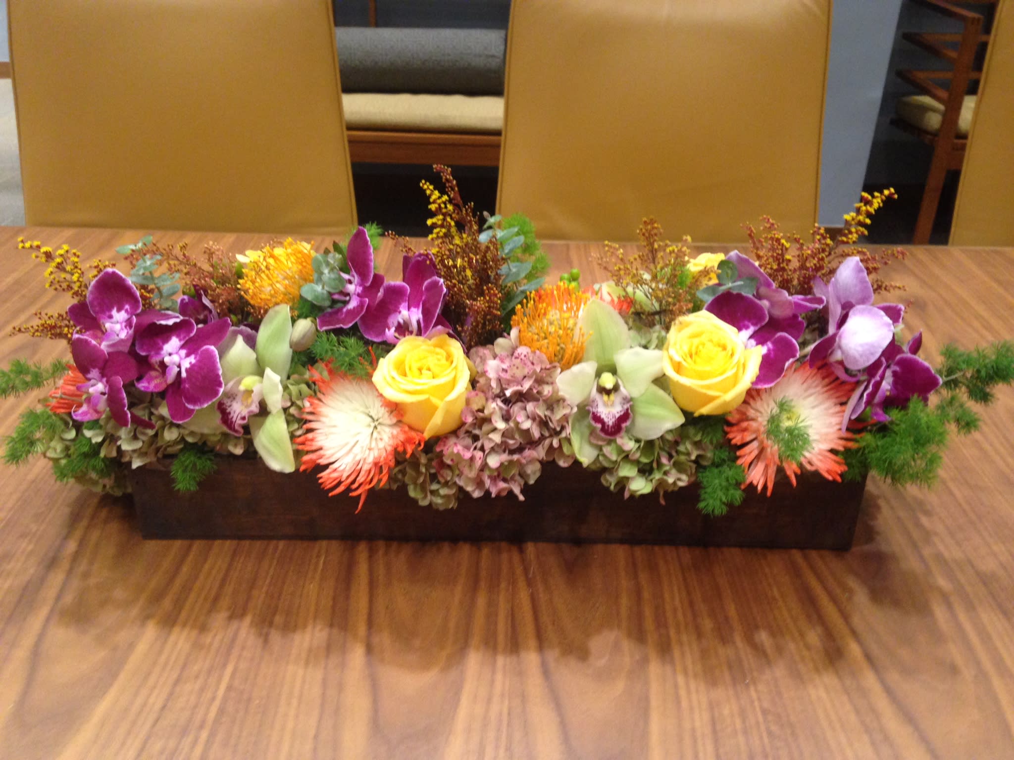 Simply Beautiful Simply Beautiful - This Long & Low design is custom made with Hydrangea, Roses , Cymbidium Orchids & Other Gorgeous Flowers. It is great for any occasion !