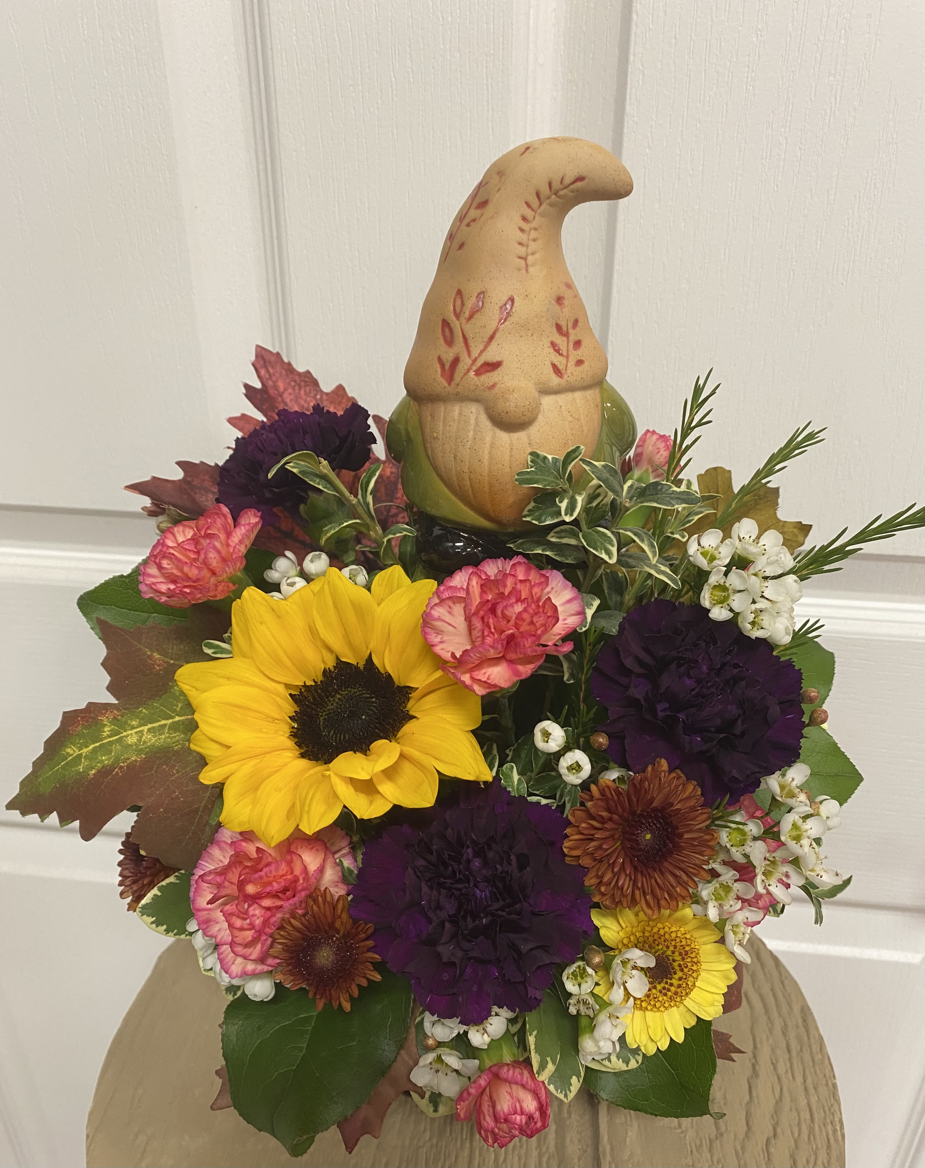 Love of Gnomes - Get this arrangement for a gnome lover! Comes with a decorative bobblehead Gnome and beautiful flowers.  The flowers will vary based on current supply of flowers.