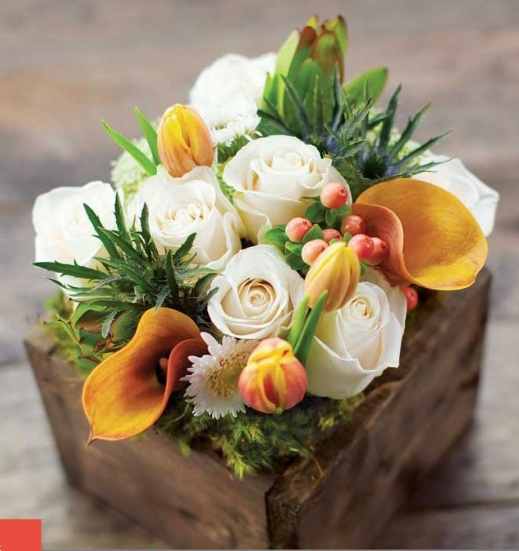 Rustic Box - Wooden box fill with seasonal flowers combination . Very popular floral arrangement with natural elements .