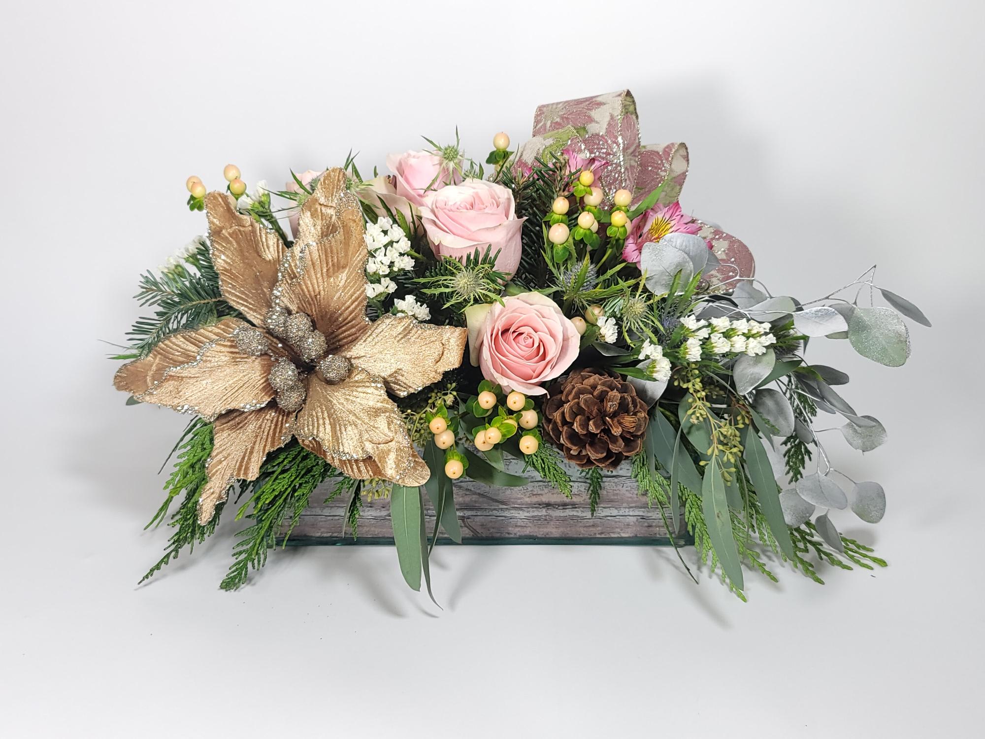Vintage Christmas - An arrangement made of roses, hypericum, pines, a gold Christmas flower, and greenery to complement 