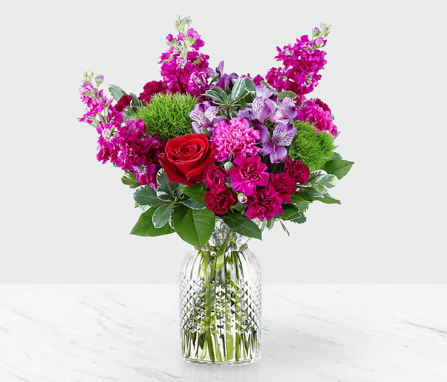 Falling for You™ Bouquet - Brighten up your Valentine's Day with a bouquet that has a message of love bursting from the vase. Comprised of an array of red roses, green trick dianthus, fuchsia stock and purple alstroemeria, Our Falling for You Bouquet is full of romantic blooms that will captivate your special someone. This arrangement is artfully complete with violet mini carnations, fuchsia standard carnations, variegated pittosporum, and luscious salal, making it a bouquet that shines with effortless beauty. GOOD bouquet is approx. 16&quot;H x 14&quot;W. BETTER bouquet is approx. 17&quot;H x 15&quot;W. BEST bouquet is approx. 18&quot;H x 17&quot;W.  