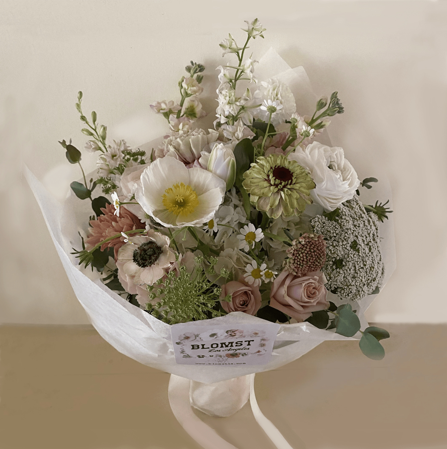 Mini Meadow Mini Meadow - A gorgeous wild bouquet of natural stems, as natural as were they just taken from a meadow. Light and dreamy in colors of white, green, brown, lavender and other pretty pastels. A small but very pretty flower gift, wrapped with moist and beautiful paper and ribbon. Ready for hand delivery in LA.