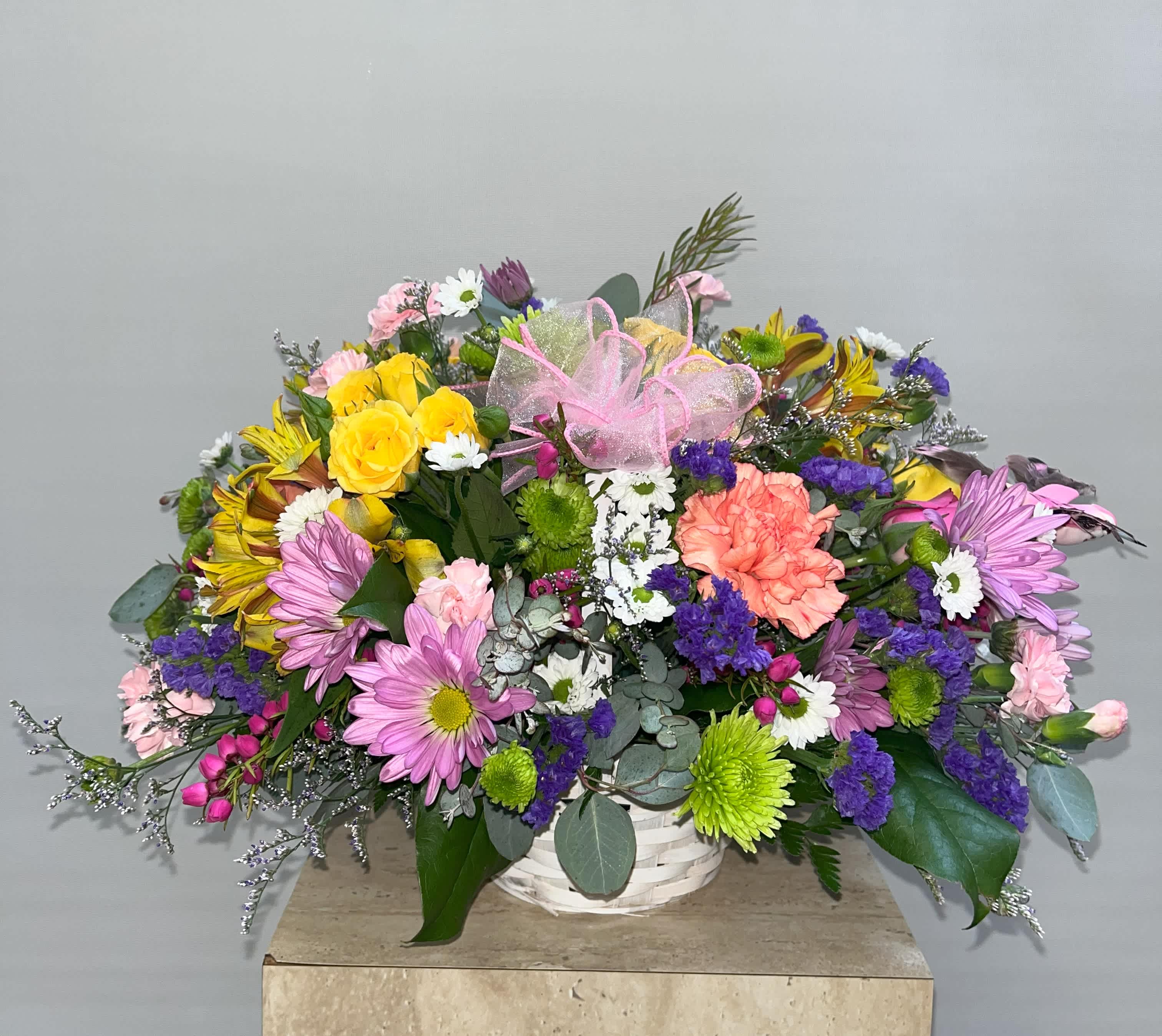 Colorful Mixed Basket - This colorful mixed basket has everything in it, with every color of the rainbow, and would definitely brighten someone's day.  Acceptable for any occasion. 