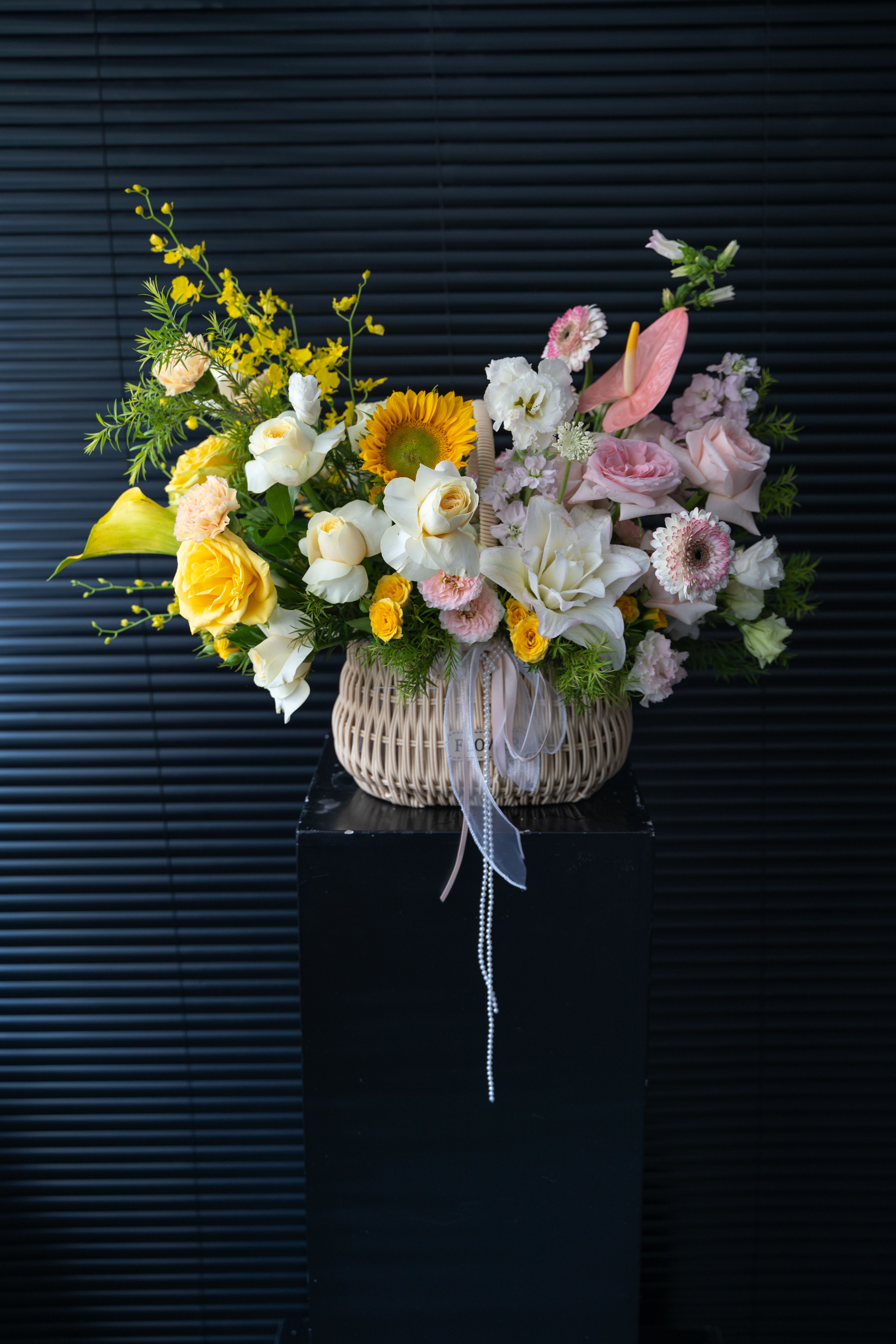 spring feast - The products include sunflowers, lilies, roses, dahlias, eustoma, Myosotis, and Calla lily, which are placed in straw baskets.