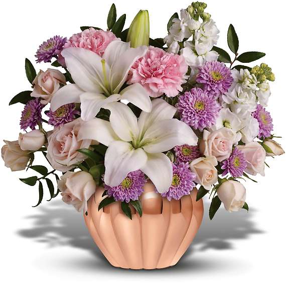 LOVE'S SWEET MEDLEY LOVE'S SWEET MEDLEY - Birthday? Anniversary? Thinking of you? Whatever the occasion, here's an affordable gift that's sure to be a huge hit. Roses, lilies and other favorites in a lovely rose gold Jardiniere vase - who wouldn't love it? The exquisite bouquet includes light pink spray roses, white lilies, pink carnations, white stock and lavender cushion spray chrysanthemums accented with fresh greenery.