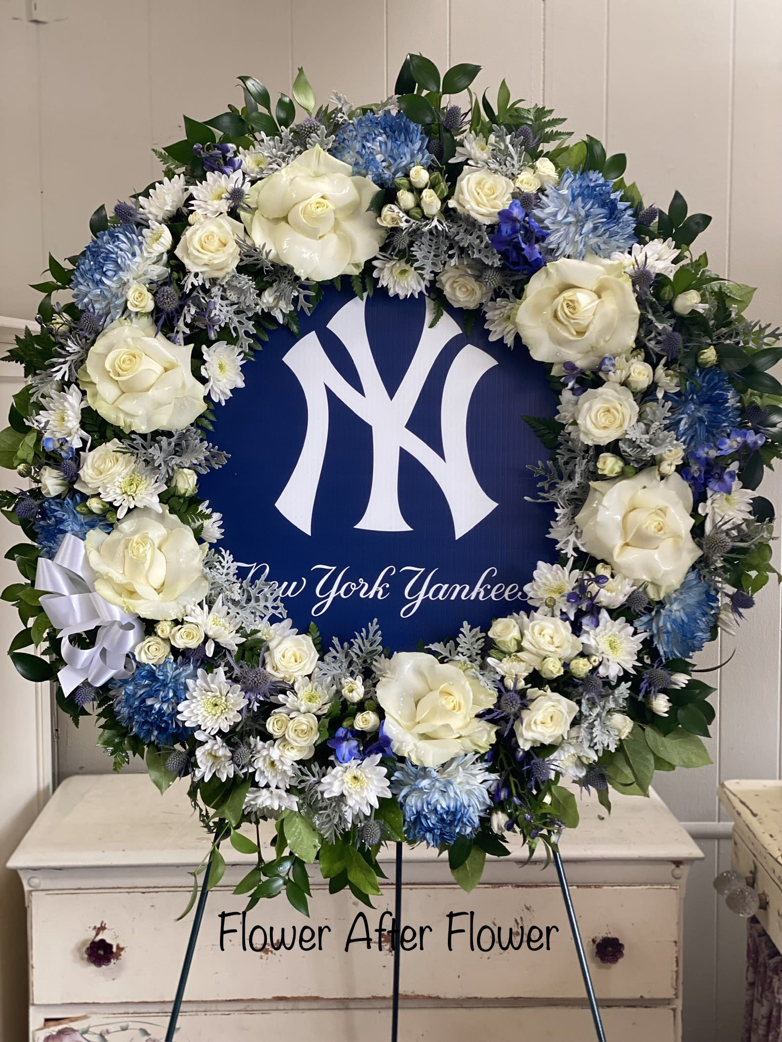 Eternally A Yankee Fan - This “uniquely ours” fan favorite sympathy tribute in honor of your #1 fan, will truly bring a smile and evoke happy memories of your loved one.   Each wreath is uniquely created especially for you and will vary slightly. Also available for Mets, Rangers, Islanders, Jets, Giants