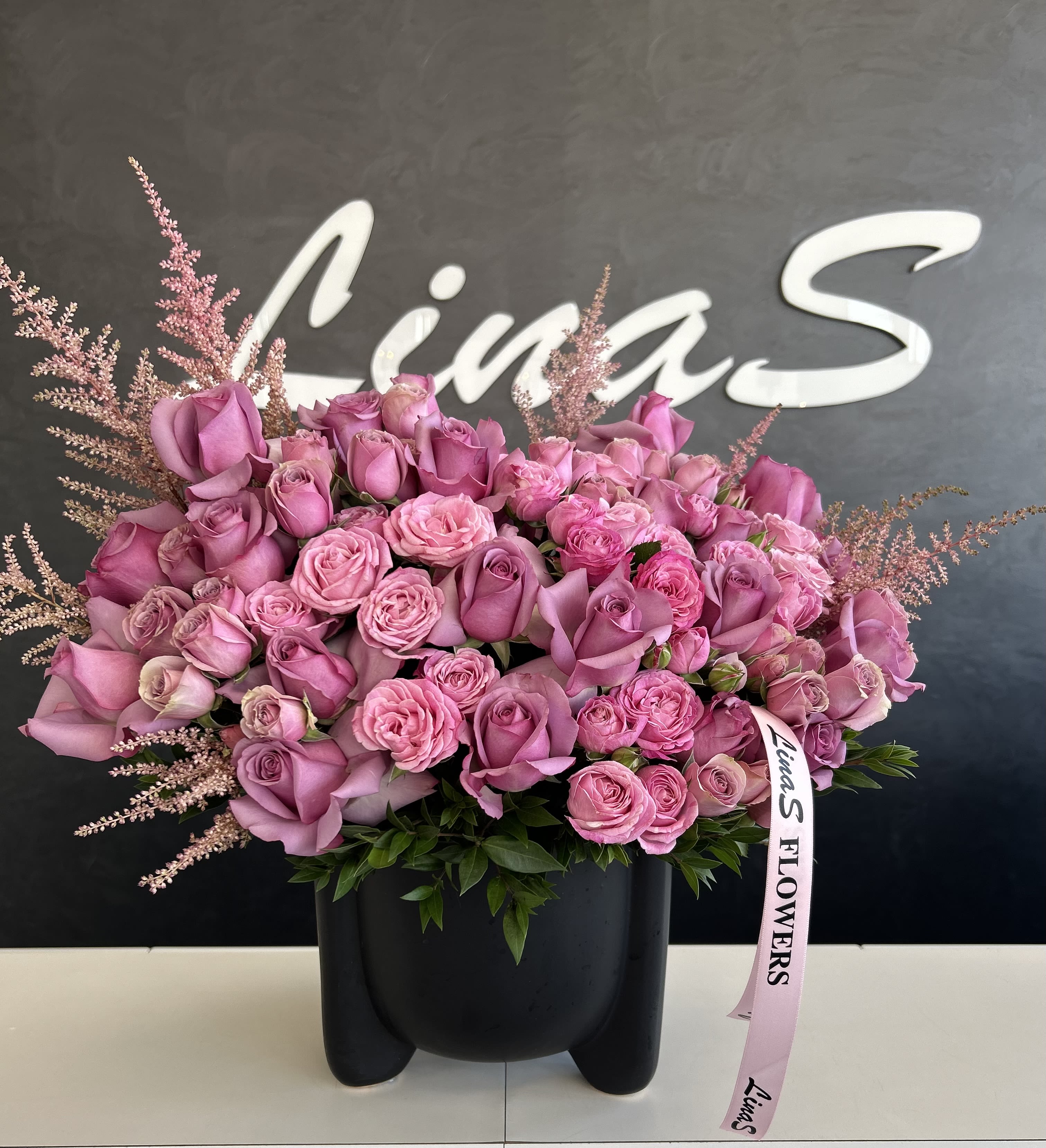 Didi Didi - A stunning arrangement of purple roses, showcasing their rich, deep hues and elegant petals. This sophisticated bouquet symbolizes enchantment and admiration, making it a perfect choice for expressing appreciation or love on any special occasion.