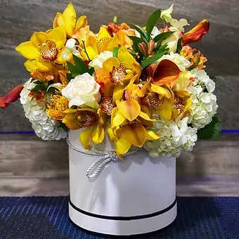 Tropical Breath - Elegant composition in a box, collected from a variety of flowers and exquisite orchids, amazes with its refined combination of shapes and shades. Orchids give the bouquet a special luxury and elegance, making it truly unique. This gift will become a symbol of beauty and fine taste!