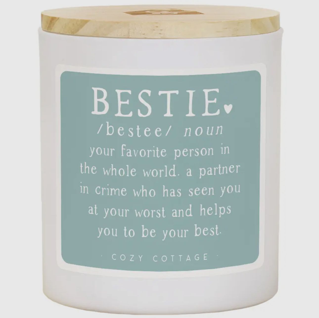 Bestie Definition Candle Bestie Definition Candle - Elevate your senses with our stunning candles adorned with unique and personalized sentiments on every label. These 11 oz soy wax, 2 wick candles offer the perfect gifts for everyone and every occasion. Dimensions 3.5" x 4.25" x 3.5" -- Text found in image: BESTIE /bestee/ noun your favorite person in the whole world. a partner in crime who has seen you at your worst and helps you to be your best. COZY COTTAGE Colors: Light blue, white, natural wood Additional Info: Friendship – This image celebrates the beauty of deep, meaningful friendships. The soothing colors and sentimental definition make it a heartwarming gift for any cherished friend. - friendship, sentiment, soy wax, 2 wick candle, gift, best friend, partner in crime, soothing, uplifting, cozy.