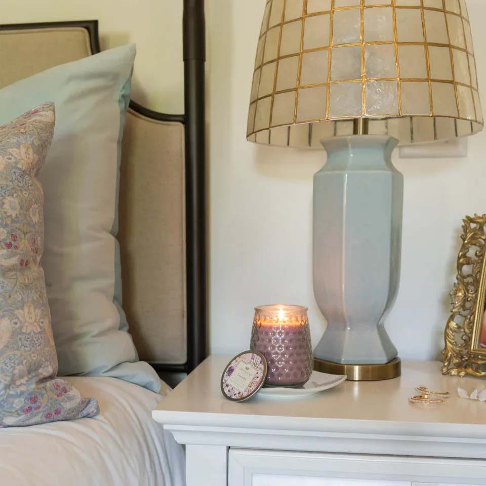 Lavender Candle Lavender Candle - With a clear, glass hobnail textured jar and a silver lid, our Signature Candle is the perfect match for any style. Fill your home with inviting Greenleaf fragrances that make any space feel cozy! What Makes it Special: Beautiful fragrance created in-house by a team of professional perfumers Fragrance: Lavender Fragrance Family: Floral Fragrance Description: A much needed tranquil encounter, Lavender combines the freshness of herbs with sweet florals to create a perfectly calm and peaceful scent. Use and Care: Burn within sight, Always trim wick to 1/4 in before lighting candle Keep candle on a level surface away from drafts Allow the wax to pool to the edge of the glass before extinguishing the flame Avoid dropping debris, such as wick trimmings, into the wax Extinguish the candle when your wax level reaches 1/4 inch Specifications Volume: 13 oz Lifespan: 90-100 hours Product Size (inches): 3.75l x 3.75w x 4.75h Package Weight (pounds): 1.75