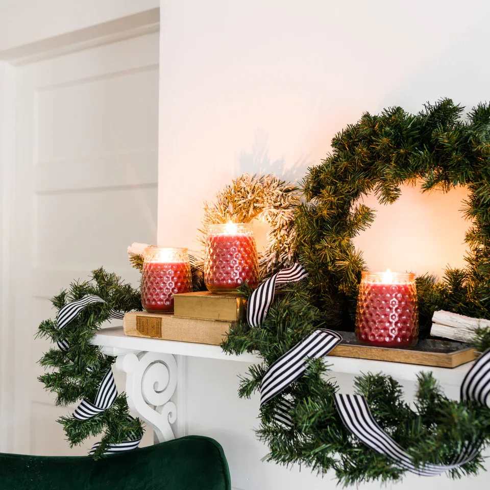 Merry Memories Candle Merry Memories Candle - With a clear, glass hobnail textured jar and a silver lid, our Signature Candle is the perfect match for any style. Fill your home with inviting Greenleaf fragrances that make any space feel cozy! What Makes it Special: Beautiful fragrance created in-house by a team of professional perfumers Fragrance: Merry Memories Fragrance Family: Sweet & Spicy Fragrance Description: Enjoy all the warmth and holiday cheer that Merry Memories has to offer through delightful notes of cinnamon, vanilla, clove, and sugared pear. Use and Care: Burn within sight, Always trim wick to 1/4 in before lighting candle Keep candle on a level surface away from drafts Allow the wax to pool to the edge of the glass before extinguishing the flame Avoid dropping debris, such as wick trimmings, into the wax Extinguish the candle when your wax level reaches 1/4 inch