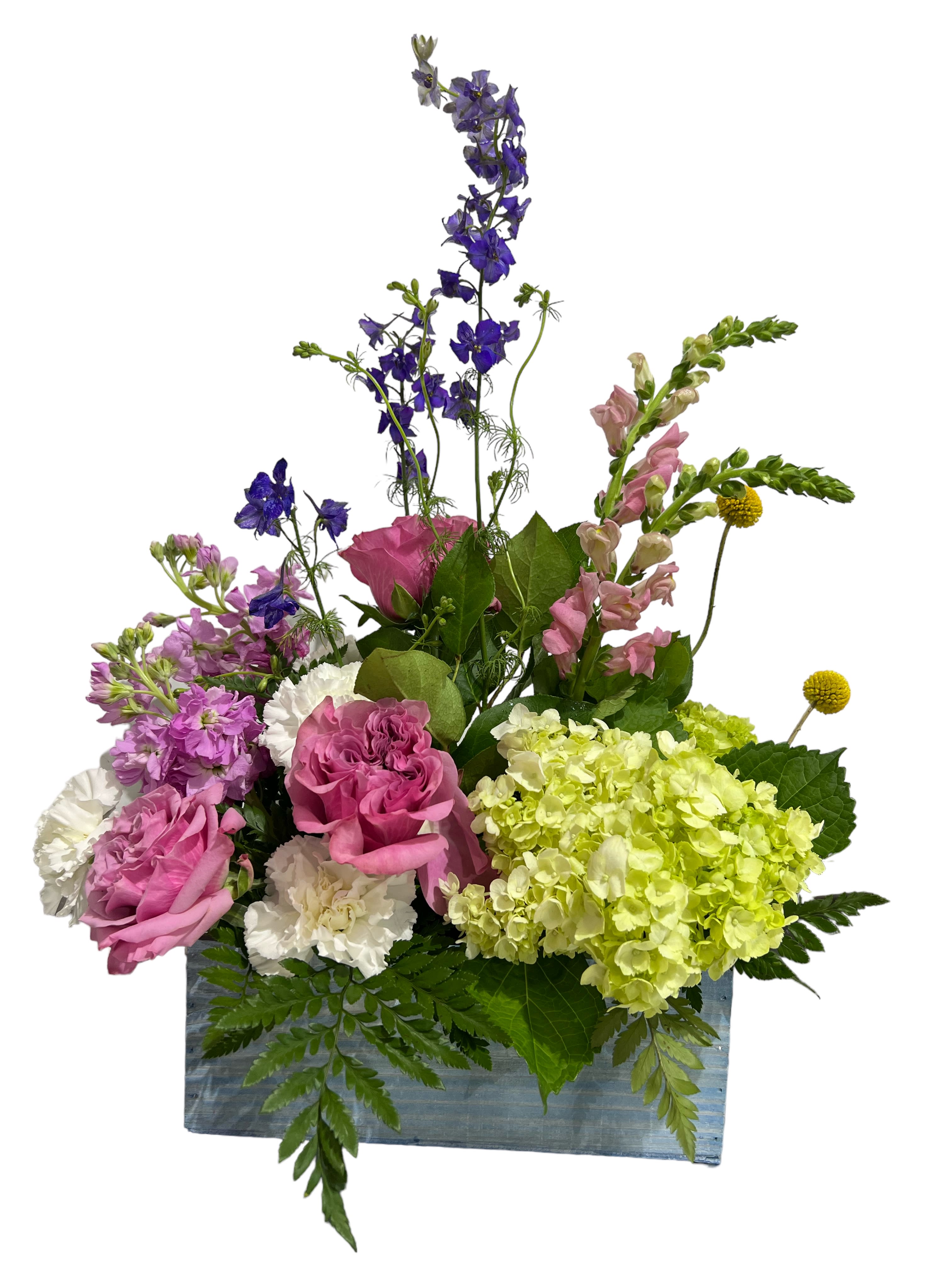 Garden Treasures Garden Treasures - Rectangular wooden box filled with everything from the garden. Purple, lavender, green, and white flowers (larkspur, roses, carnations, snapdragon, and hydrangea) filled to the brim The flowers and box may be substituted if needed but will still have the same look and feel.