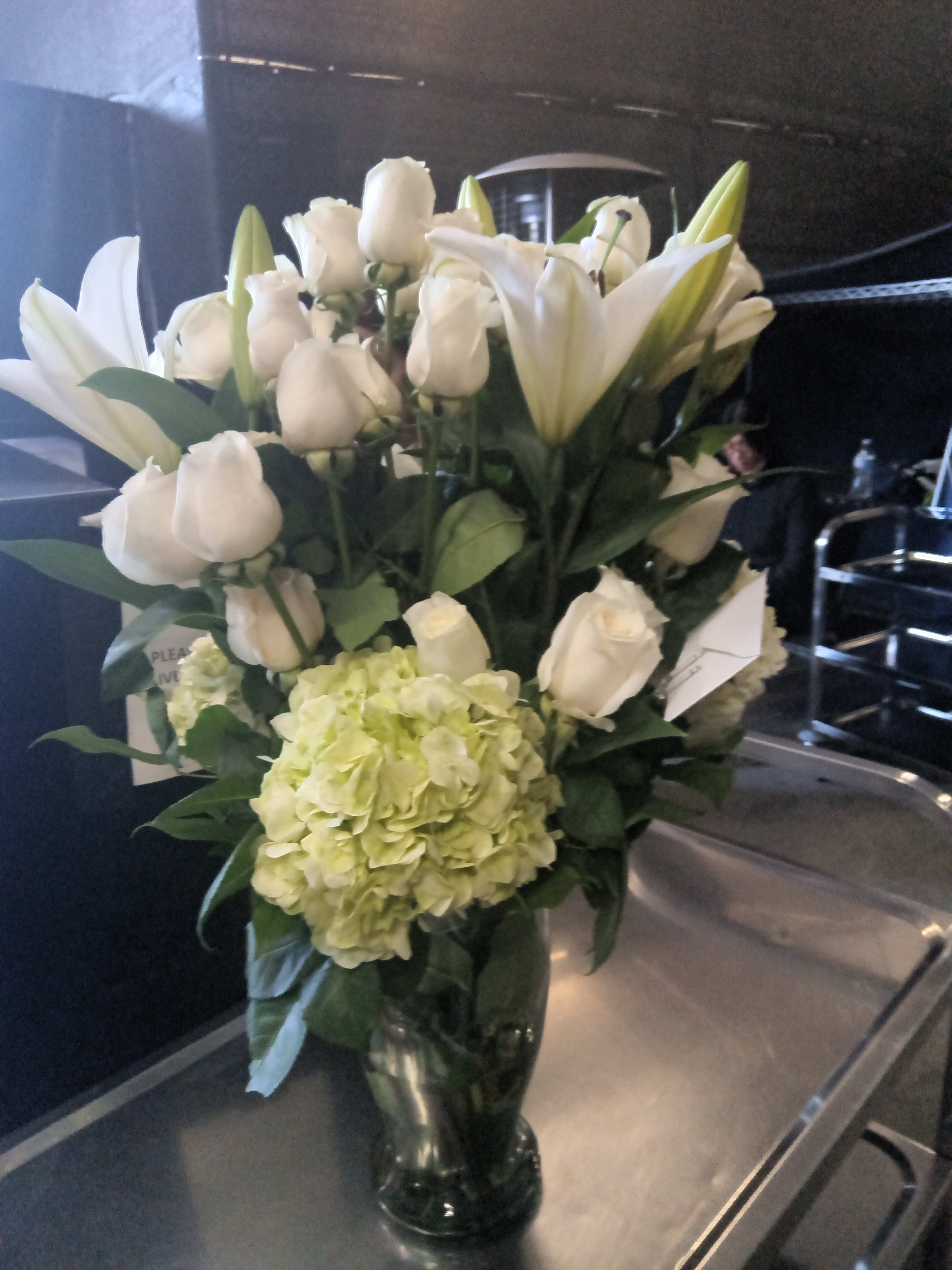 All white large flower arrangement  - White roses white lillies and hydrangea 