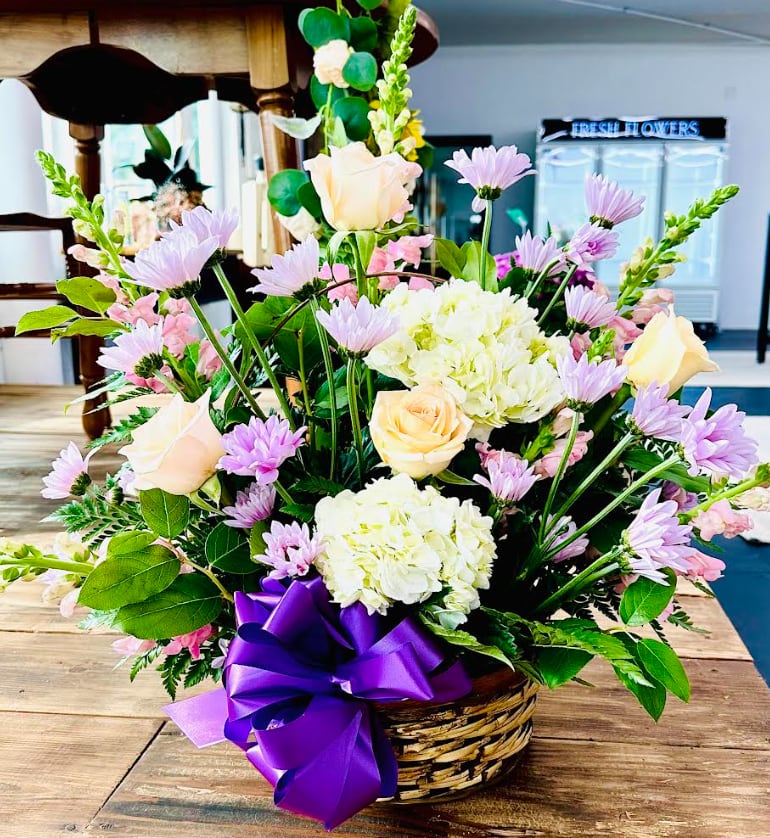 Delightful Purple - Beautiful collection of Daisies, Roses, Snapdragons, Hydrangeas and mixed greens in a baskets. Perfect for any occasion. 